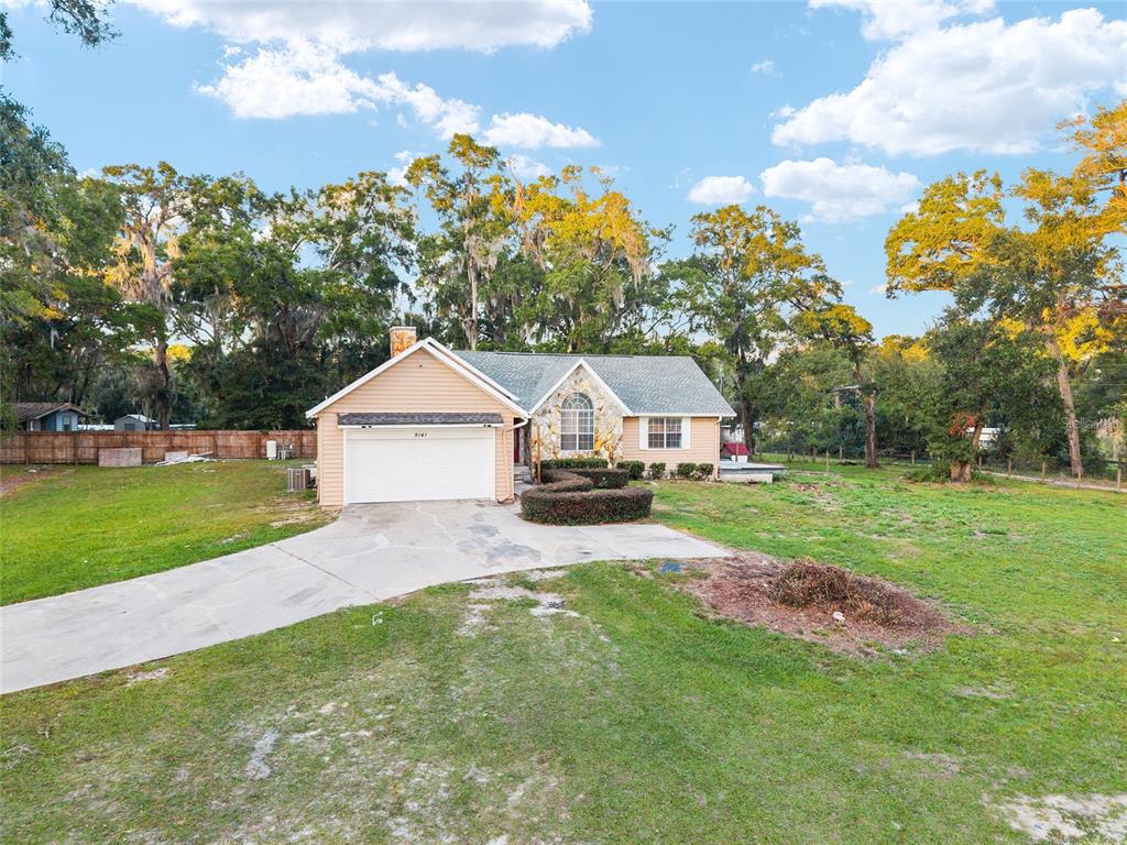 9161 Southwest 34th Place Ocala, FL 34481 - Photo 89 of 100 a view of a house with a back yard