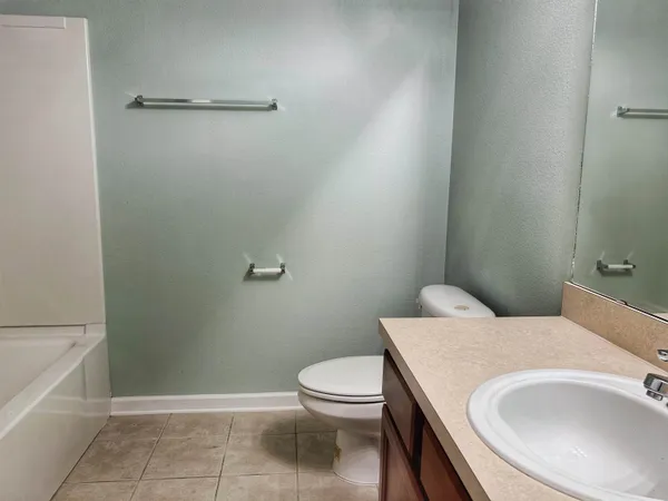 a bathroom with a sink a toilet and a bathtub