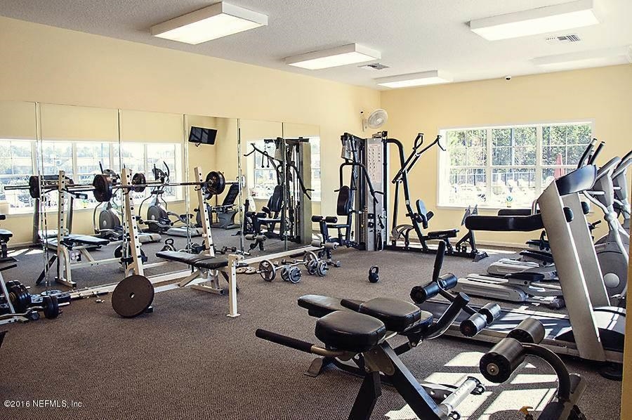 240 Golden Lake Loop St. Augustine, FL 32084 - Photo 18 of 28 a view of a room with gym equipment