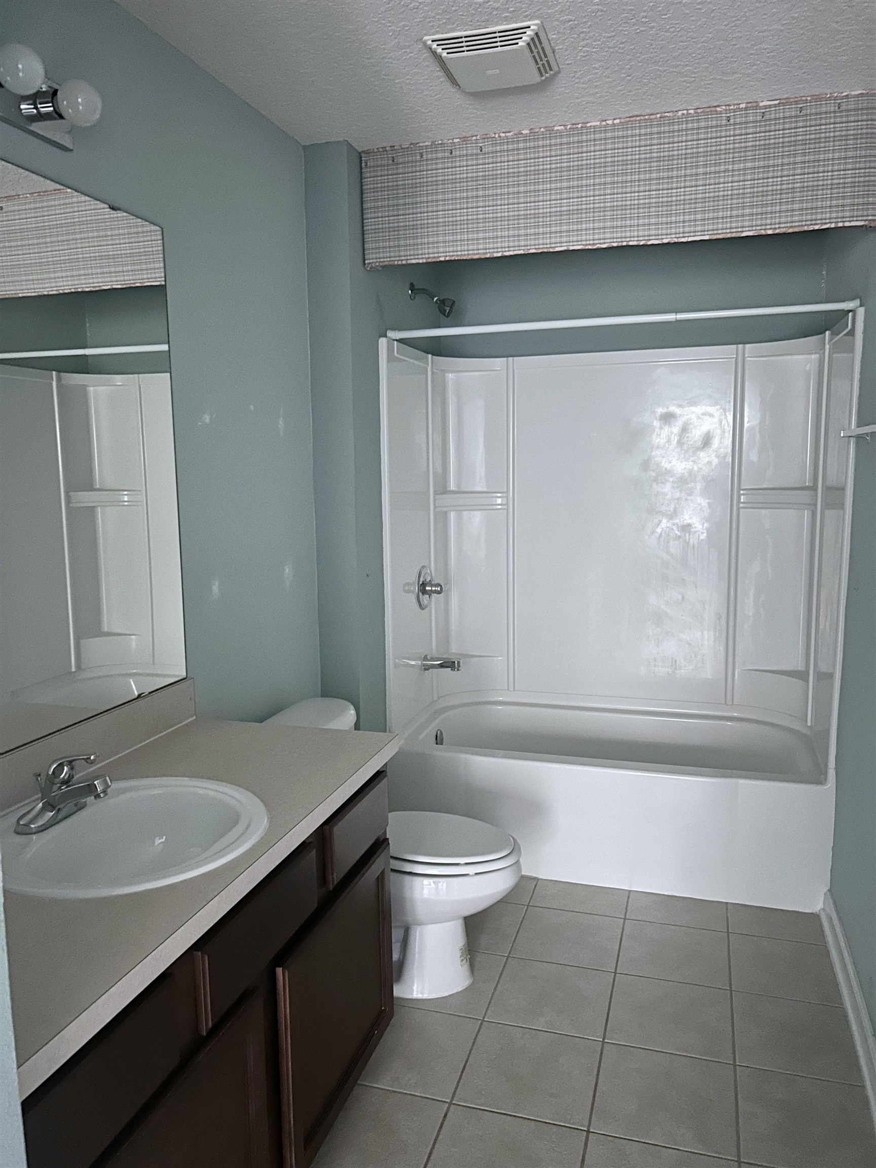 240 Golden Lake Loop St. Augustine, FL 32084 - Photo 27 of 28 a bathroom with a sink a toilet and a bathtub