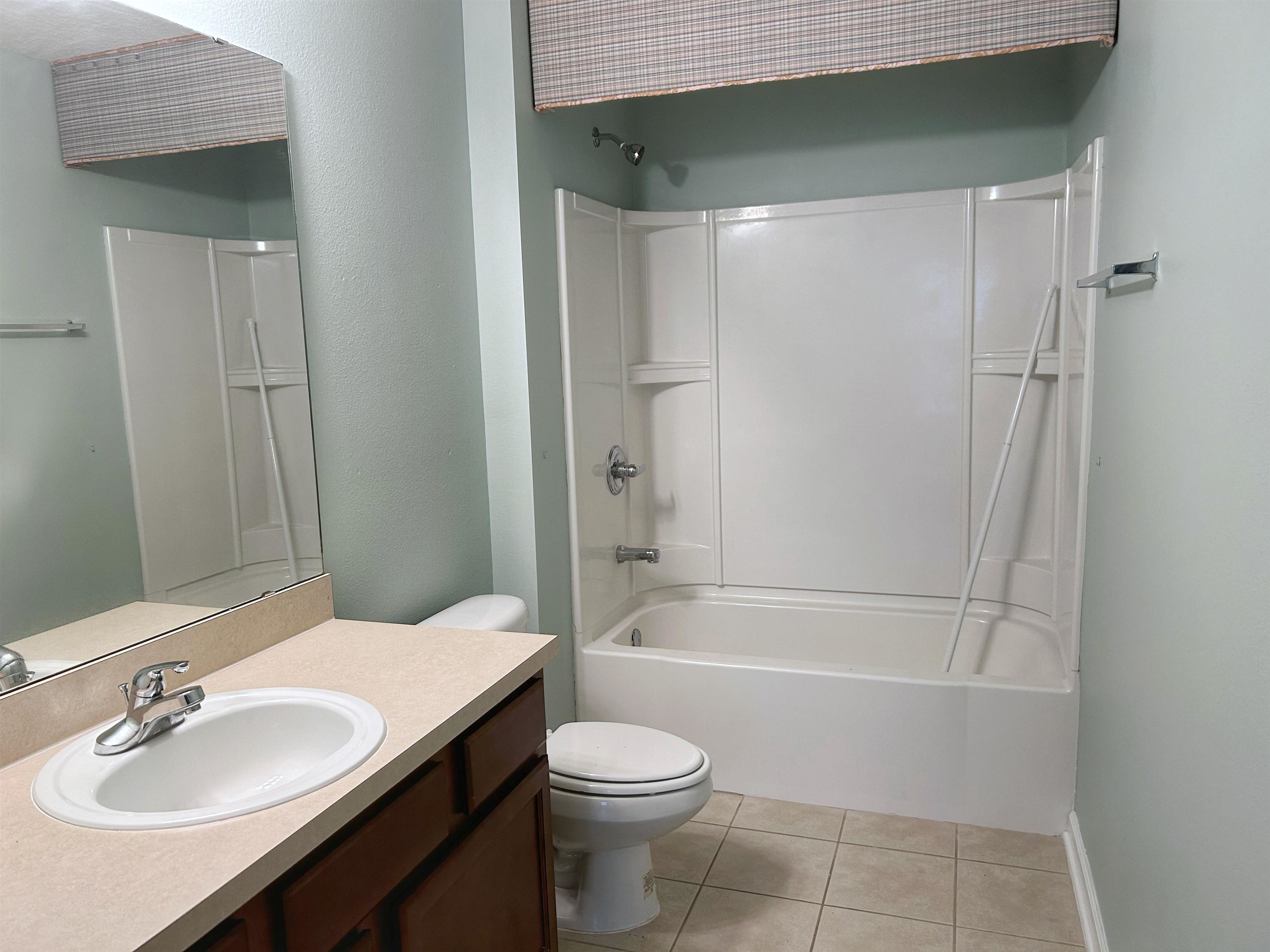 240 Golden Lake Loop St. Augustine, FL 32084 - Photo 10 of 28 a bathroom with a sink toilet and shower