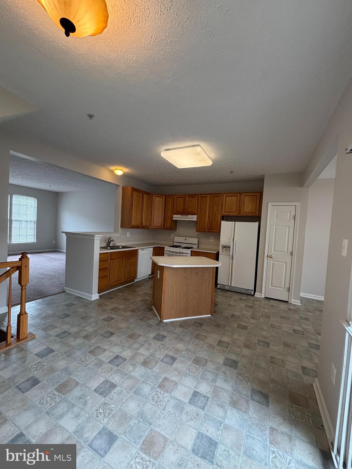 9804 Redwing Drive, Unit 9804 Perry Hall, MD 21128 - Photo 11 of 25 a large room with kitchen view