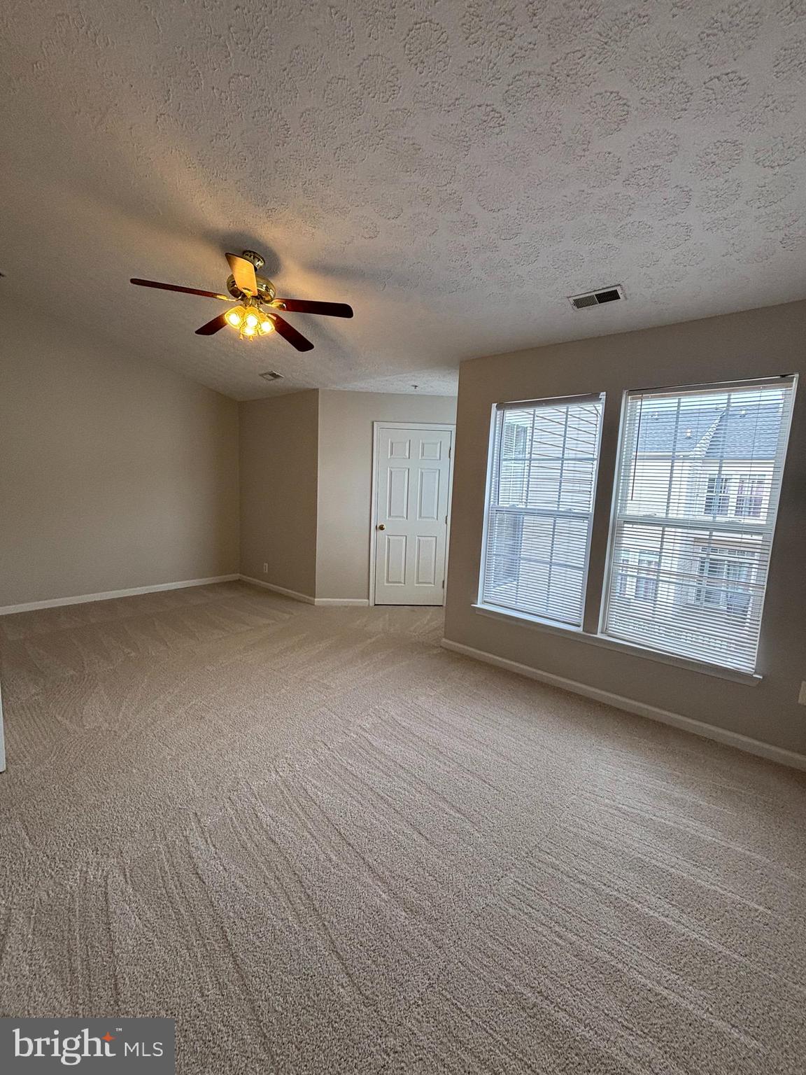 9804 Redwing Drive, Unit 9804 Perry Hall, MD 21128 - Photo 18 of 25 wooden floor in an empty room with a window