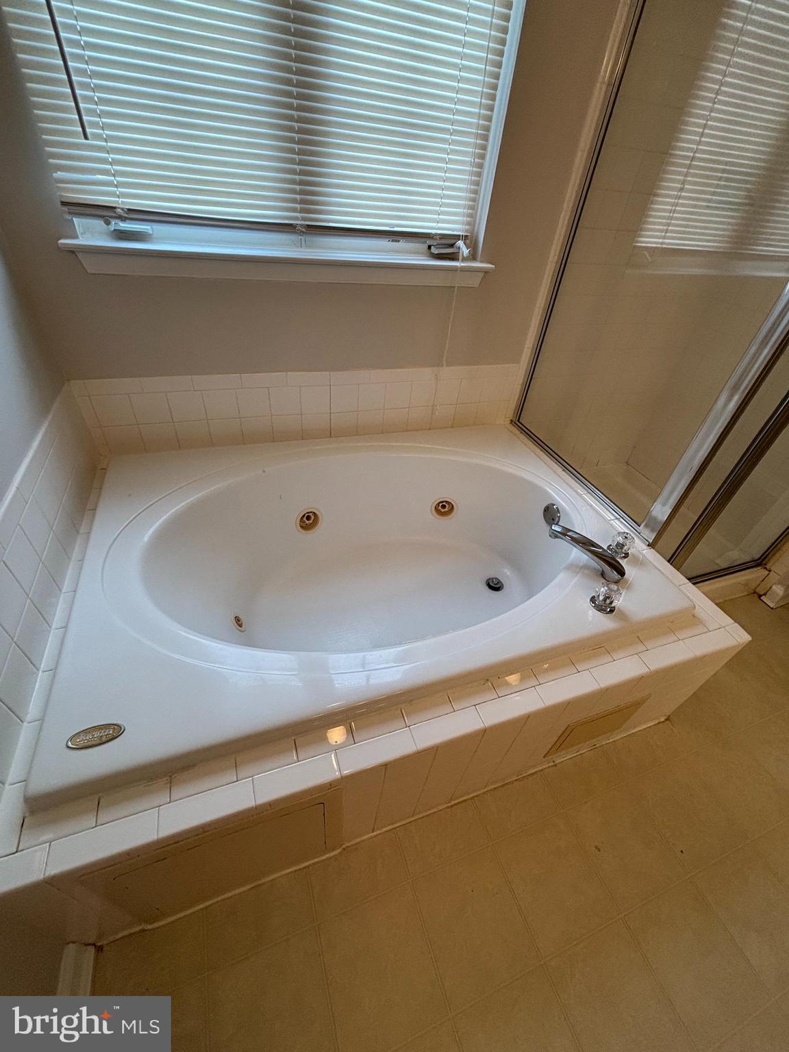 9804 Redwing Drive, Unit 9804 Perry Hall, MD 21128 - Photo 22 of 25 a bathroom with a tub