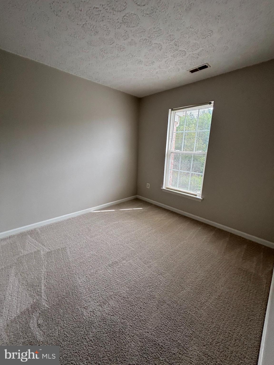 9804 Redwing Drive, Unit 9804 Perry Hall, MD 21128 - Photo 23 of 25 an empty room with a window