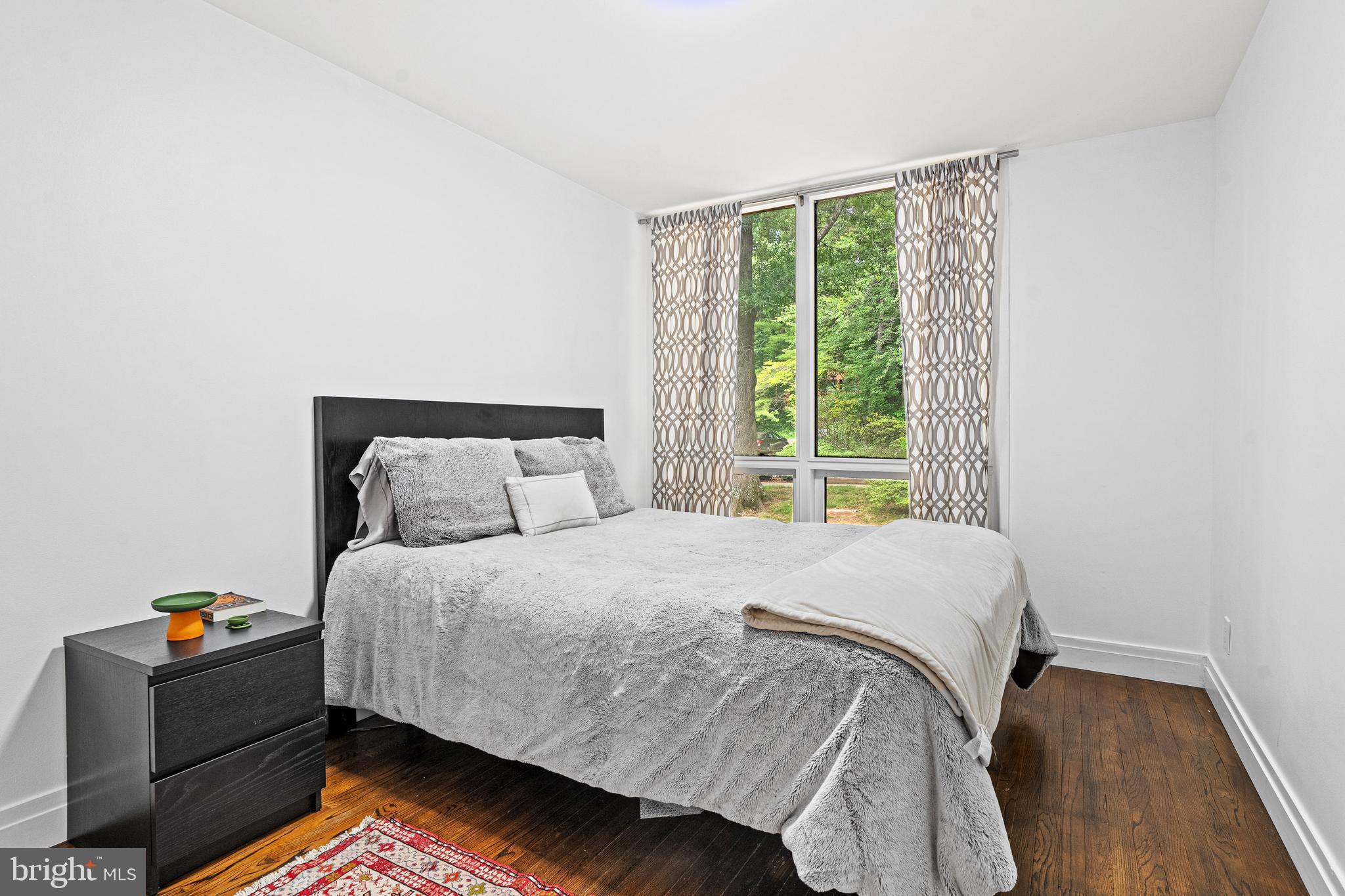1674 Chimney House Road Reston, VA 20190 - Photo 19 of 39 a bed sitting in a bedroom next to a window