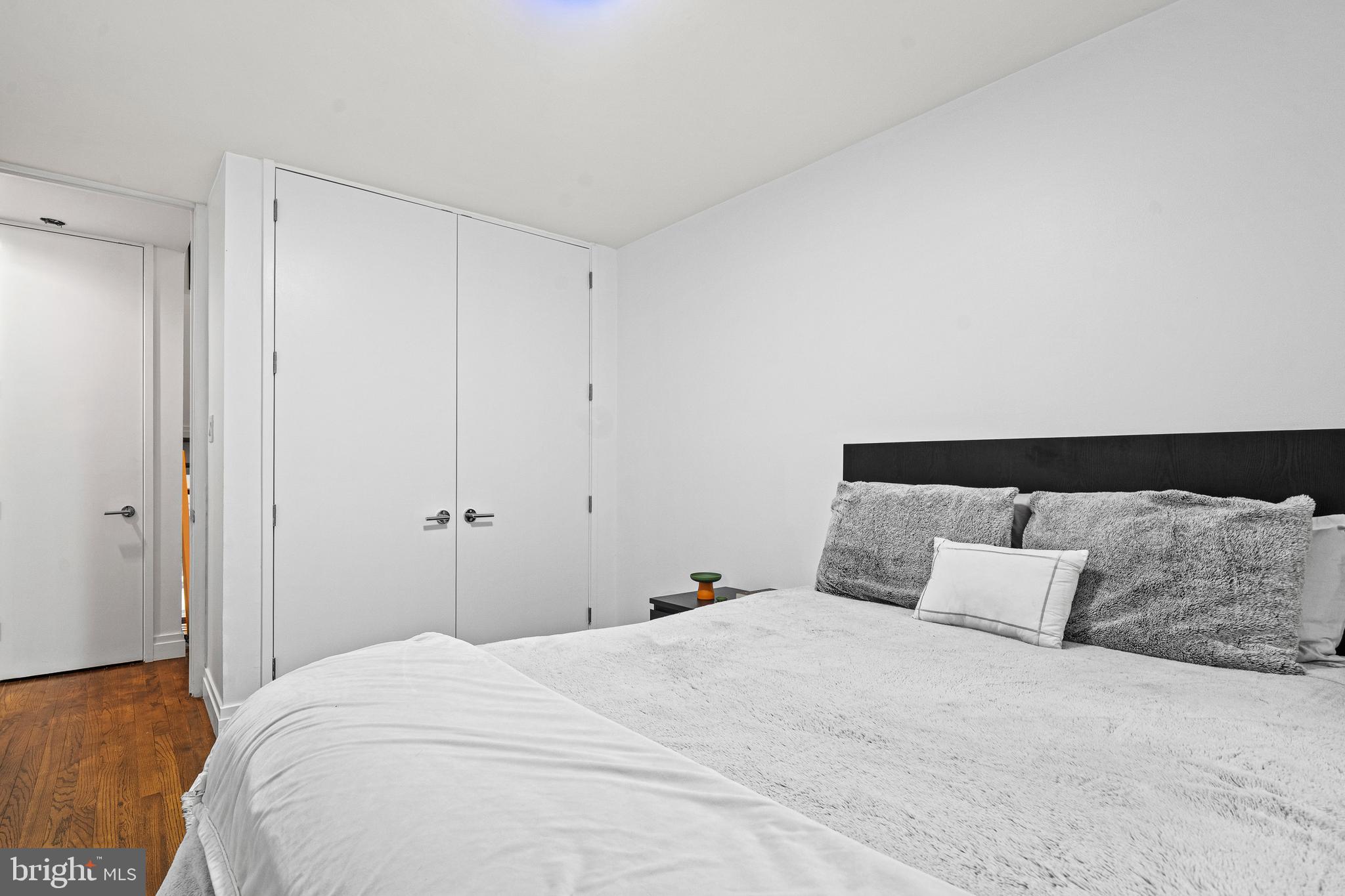 1674 Chimney House Road Reston, VA 20190 - Photo 20 of 39 a bedroom with a bed and a night stand