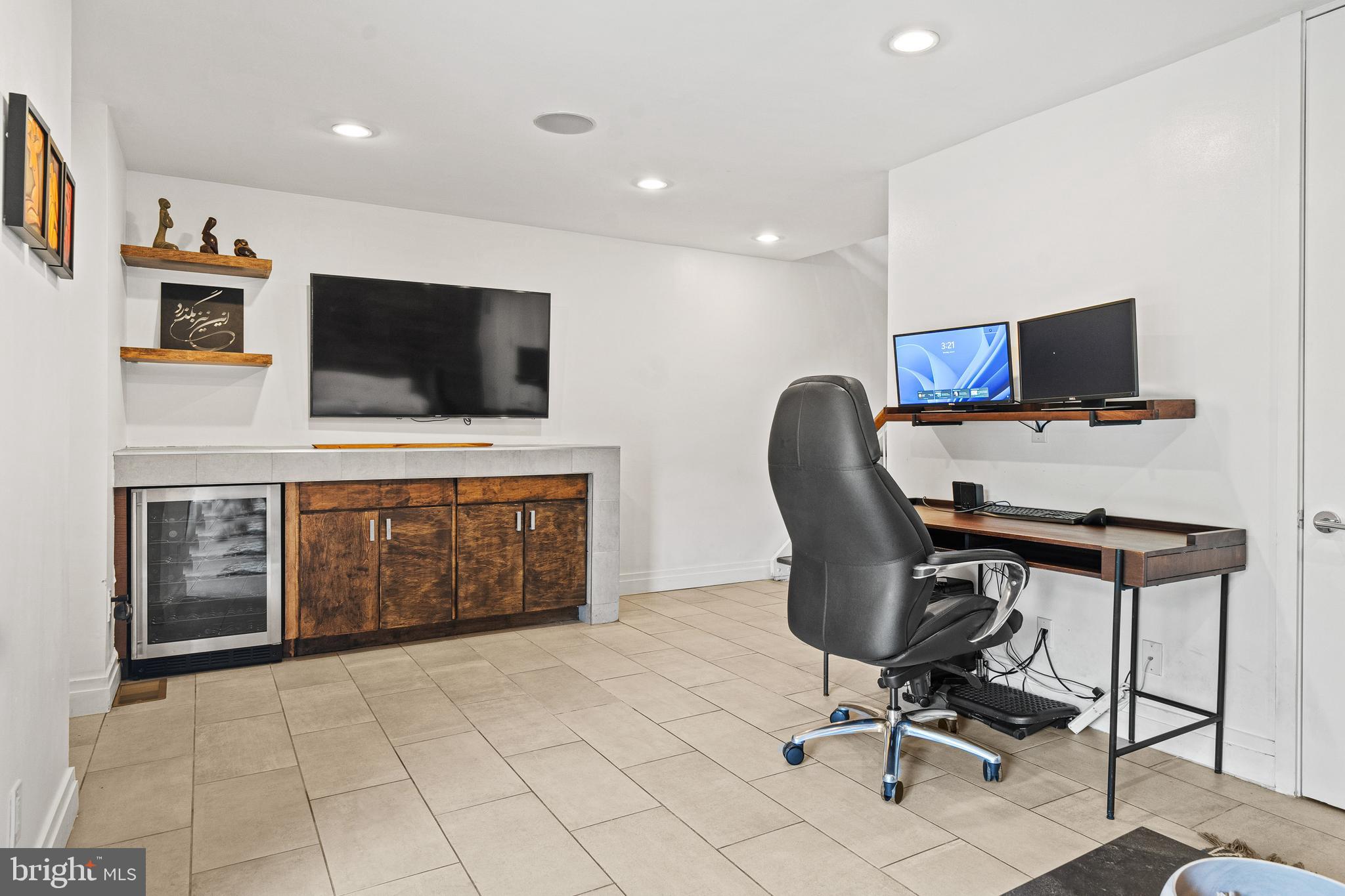 1674 Chimney House Road Reston, VA 20190 - Photo 29 of 39 a view of a livingroom with workspace and a flat screen tv