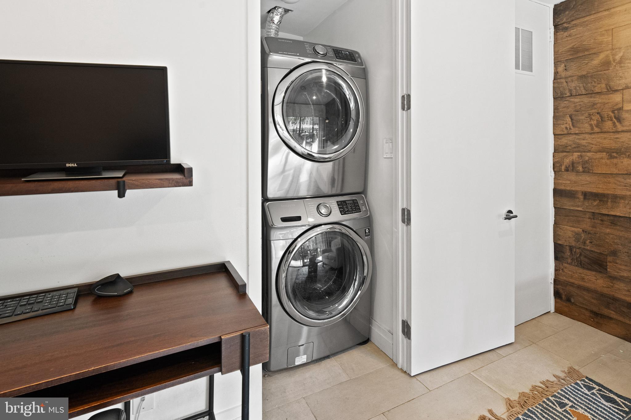 1674 Chimney House Road Reston, VA 20190 - Photo 30 of 39 a view of a storage and utility room with washer and dryer