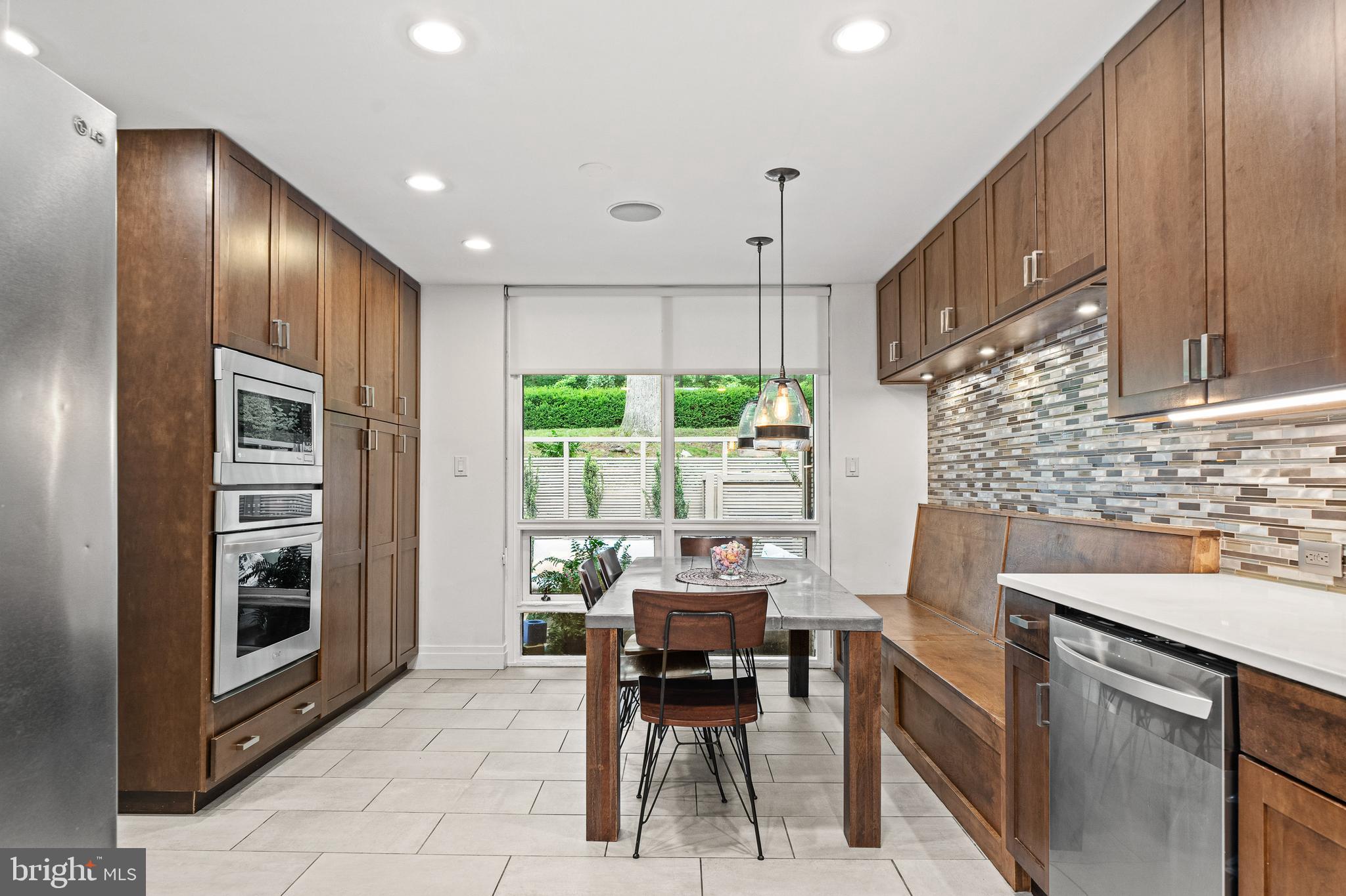 1674 Chimney House Road Reston, VA 20190 - Photo 9 of 39 a dining room with furniture and large windows