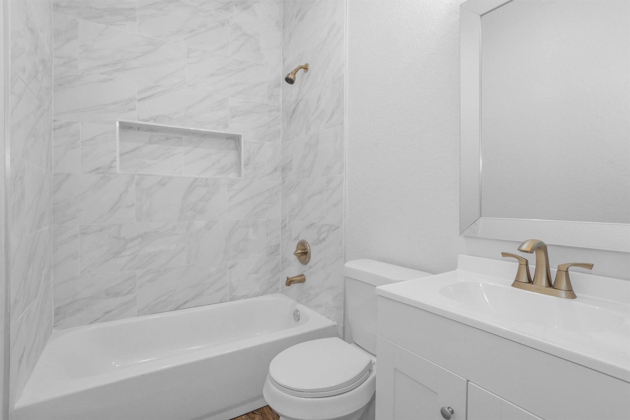 3916 Falls Street Houston, TX 77026 - Photo 13 of 28 a bathroom with a sink toilet and bathtub