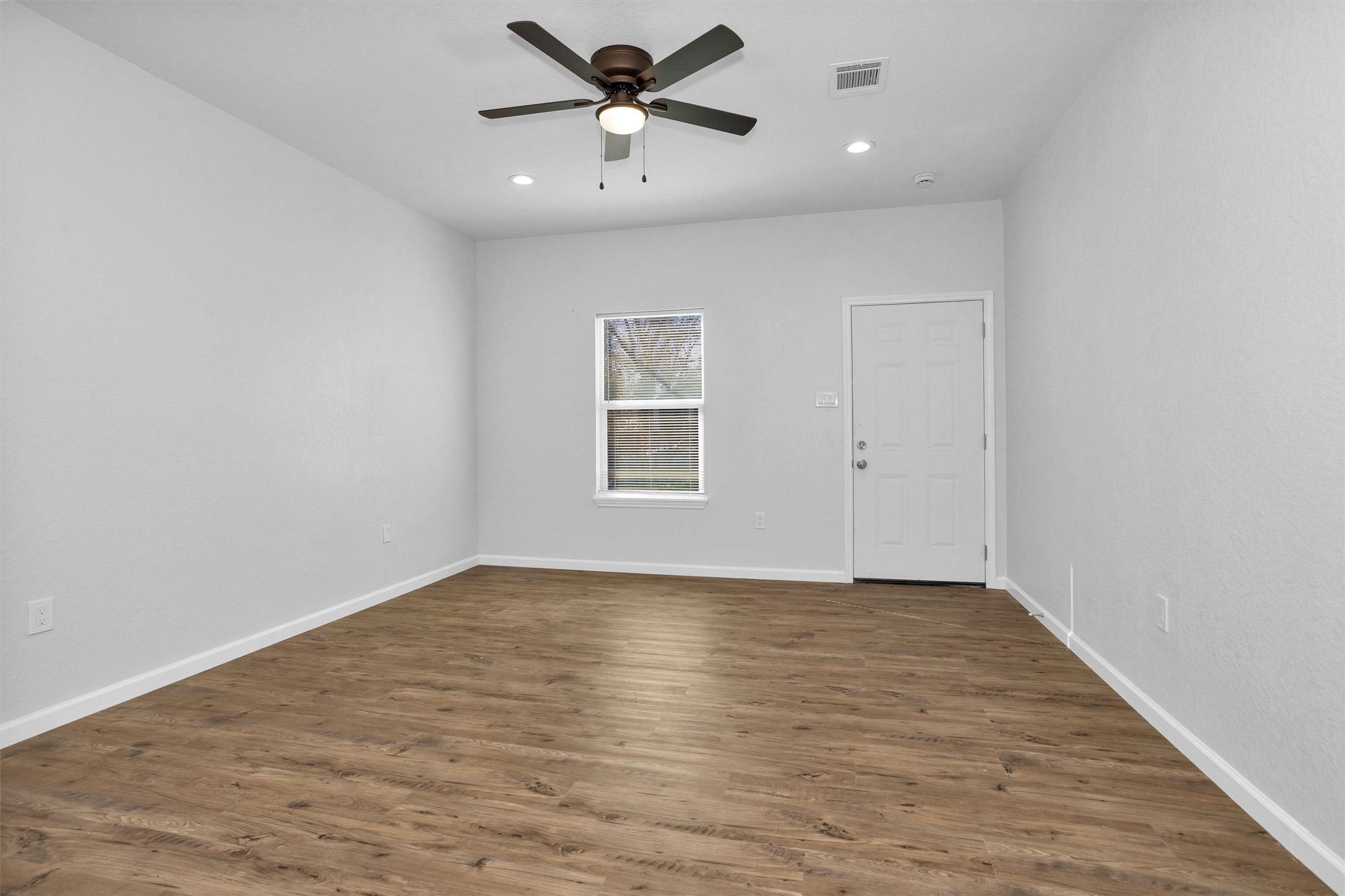 3916 Falls Street Houston, TX 77026 - Photo 19 of 28 wooden floor in an empty room