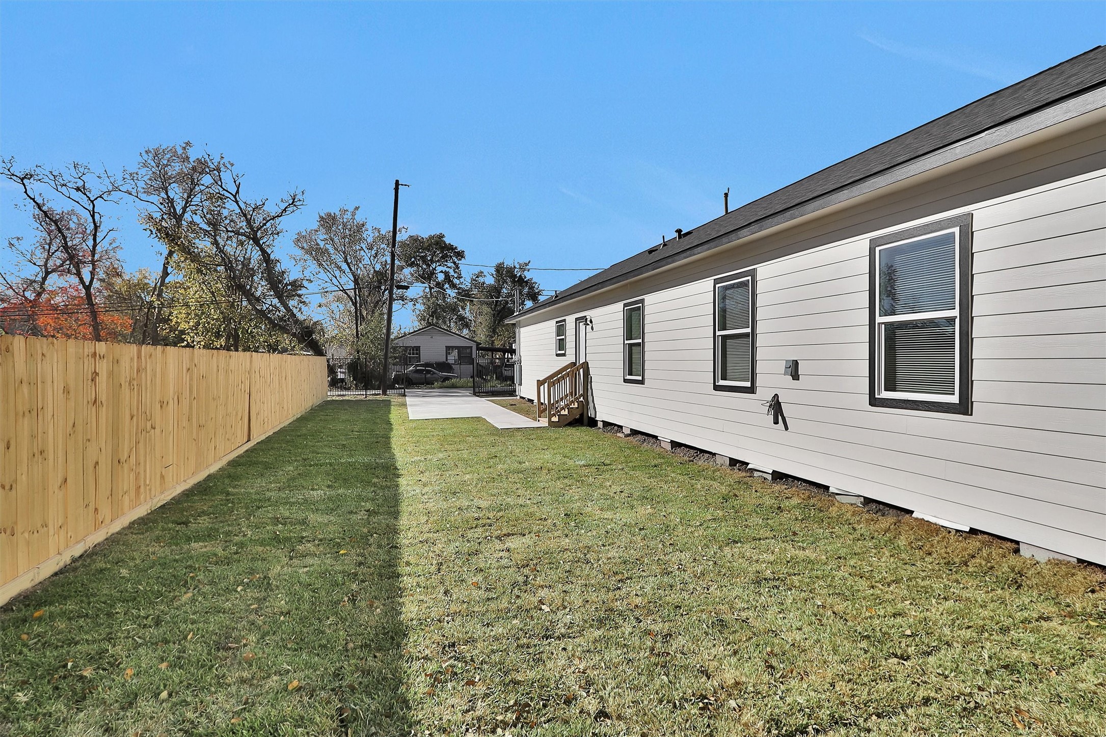3916 Falls Street Houston, TX 77026 - Photo 28 of 28 a view of a backyard with wooden fence