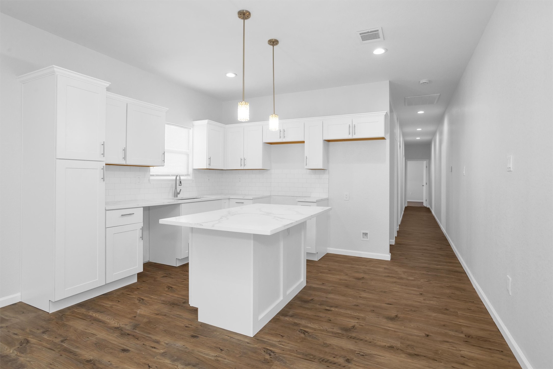 3916 Falls Street Houston, TX 77026 - Photo 6 of 28 a kitchen with a sink a window stainless steel appliances and cabinets