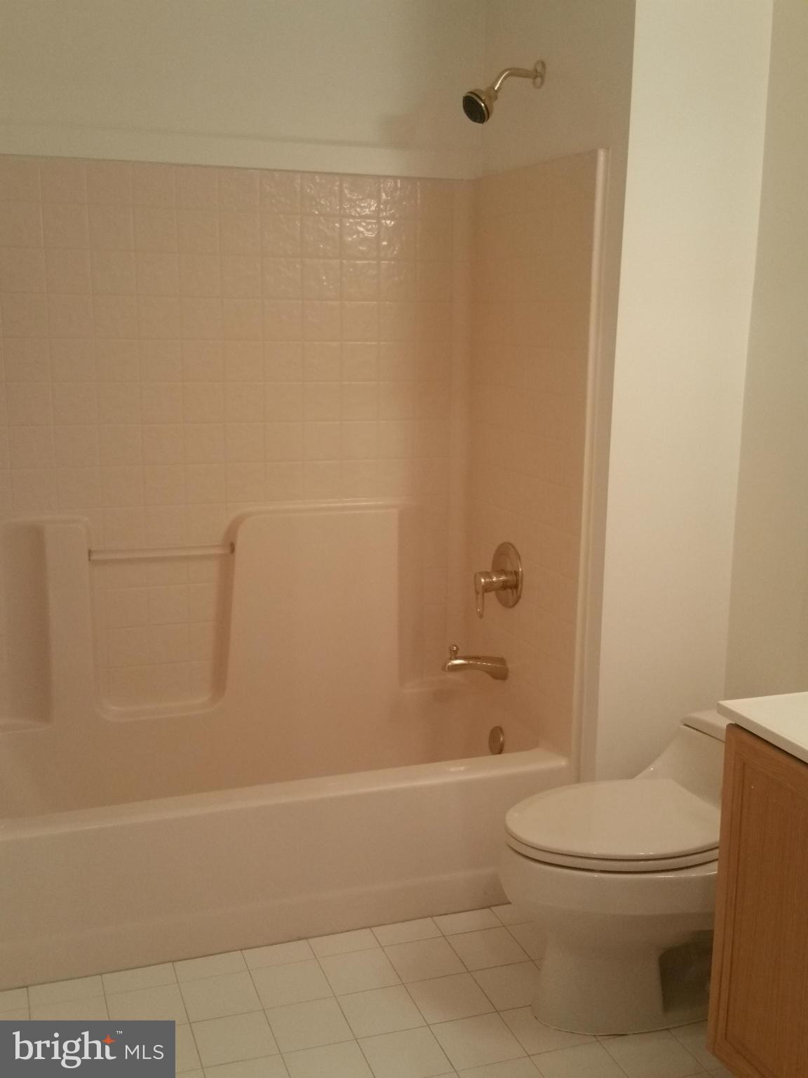 524 Runabout Loop, Unit 9 Solomons, MD 20688 - Photo 12 of 25 a bathroom with a toilet a sink and shower
