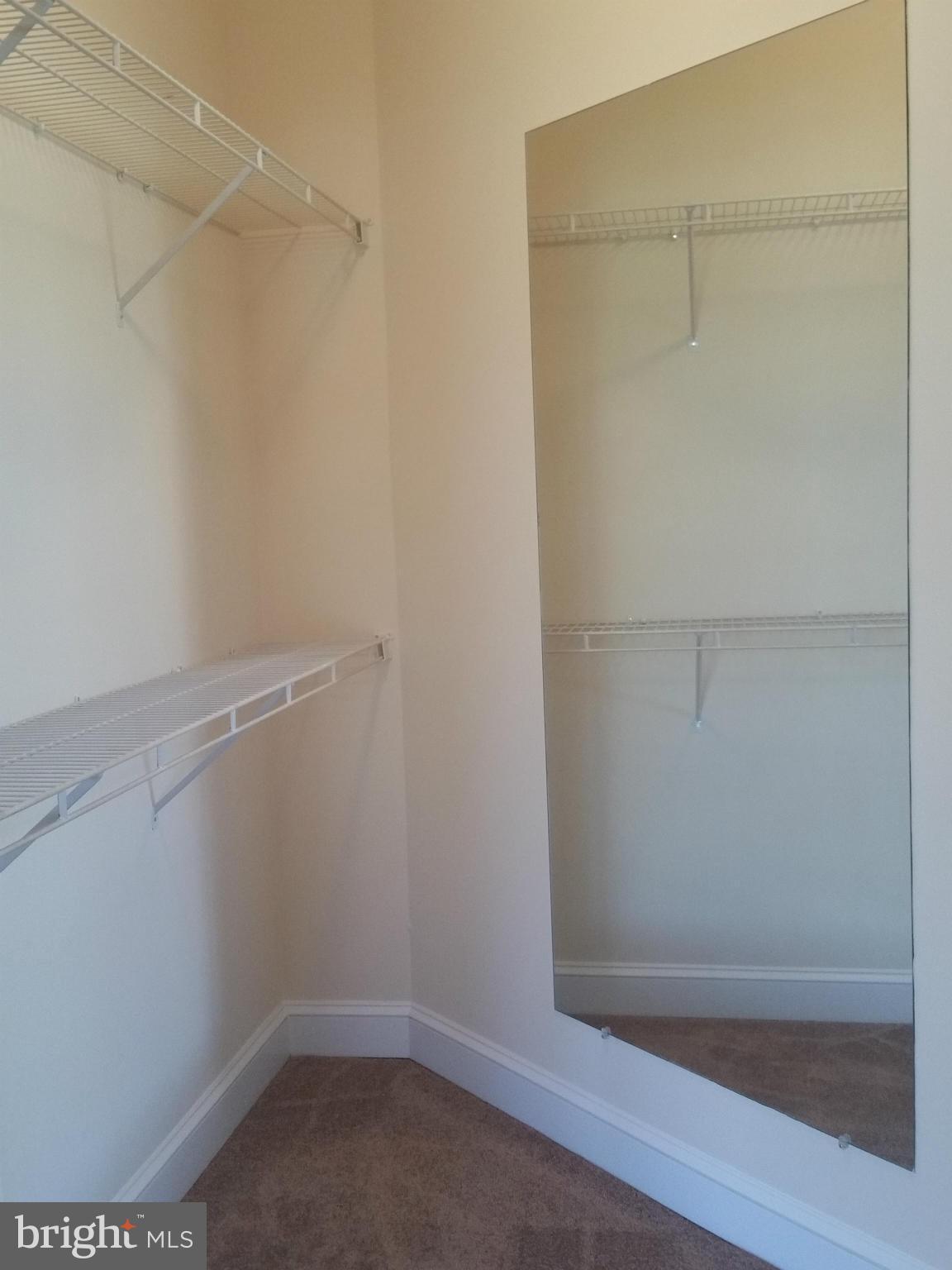 524 Runabout Loop, Unit 9 Solomons, MD 20688 - Photo 18 of 25 a view of an empty walk in closet
