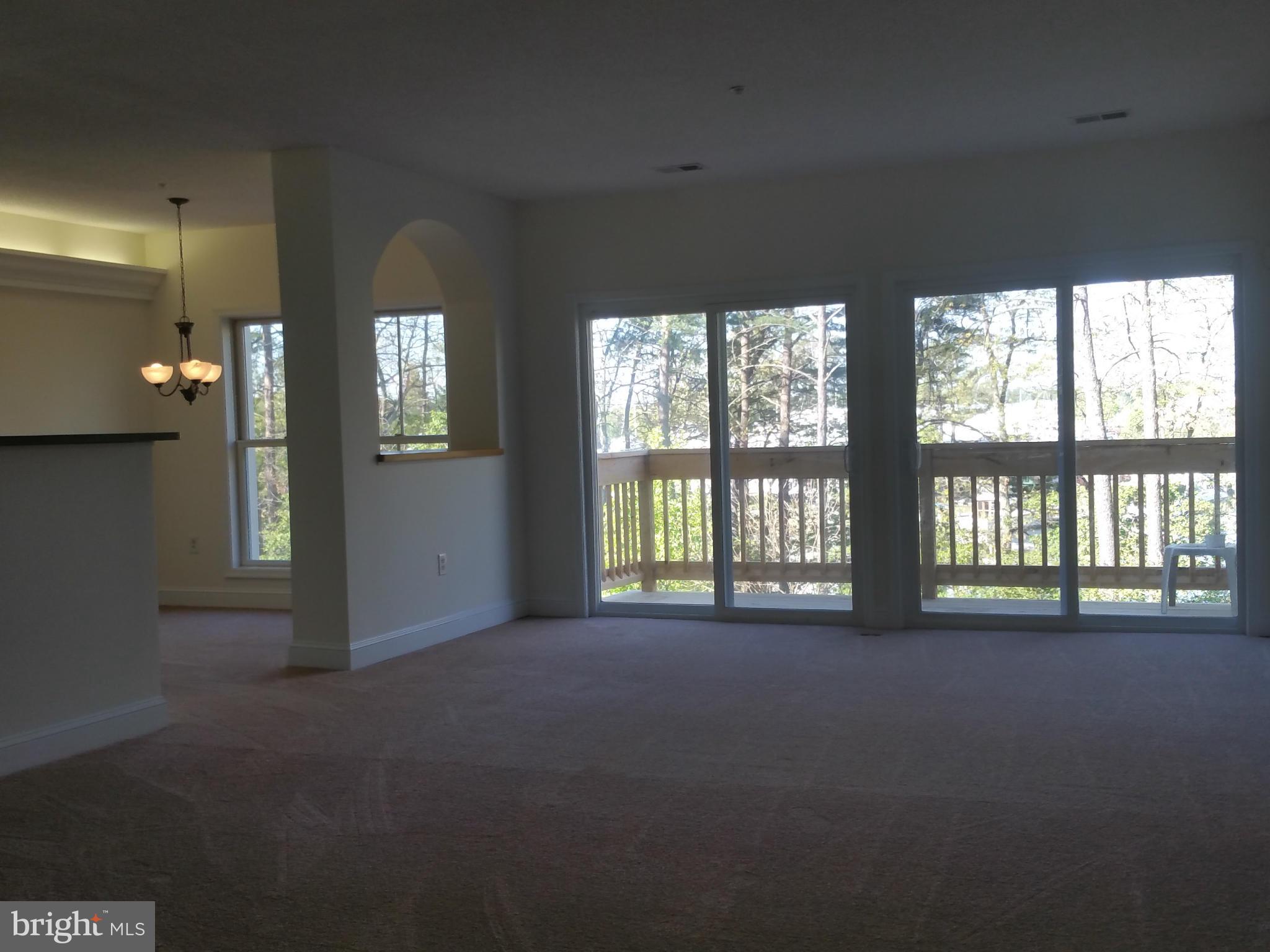524 Runabout Loop, Unit 9 Solomons, MD 20688 - Photo 3 of 25 a view of an empty room with a window
