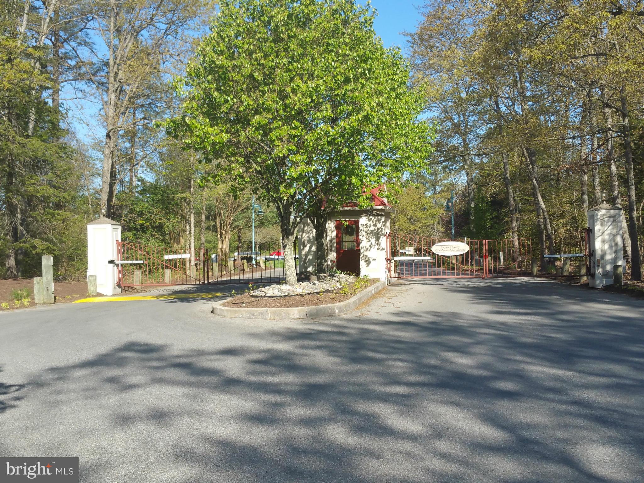524 Runabout Loop, Unit 9 Solomons, MD 20688 - Photo 24 of 25 a view of road with trees