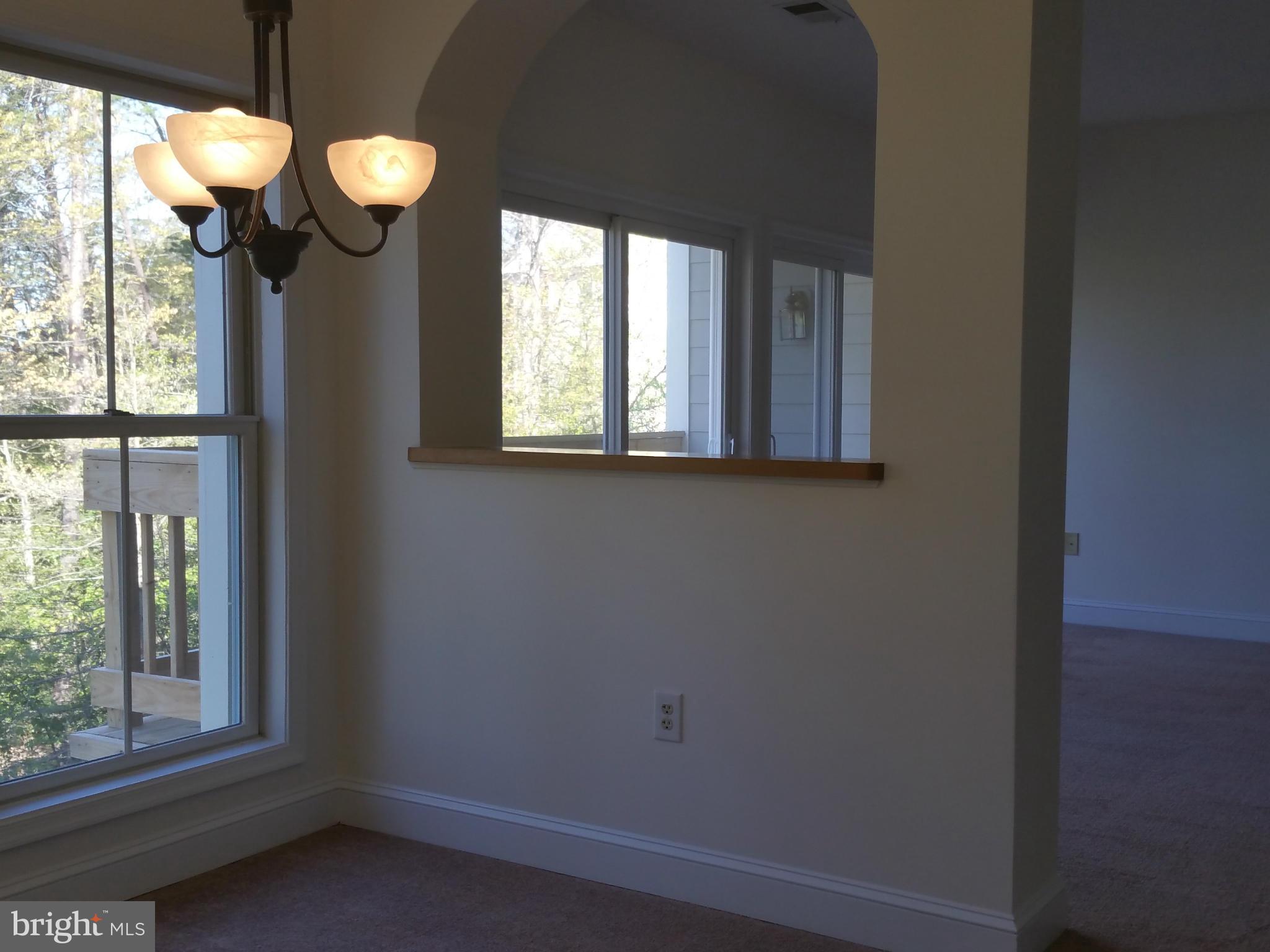524 Runabout Loop, Unit 9 Solomons, MD 20688 - Photo 5 of 25 a view of a mirror and a window