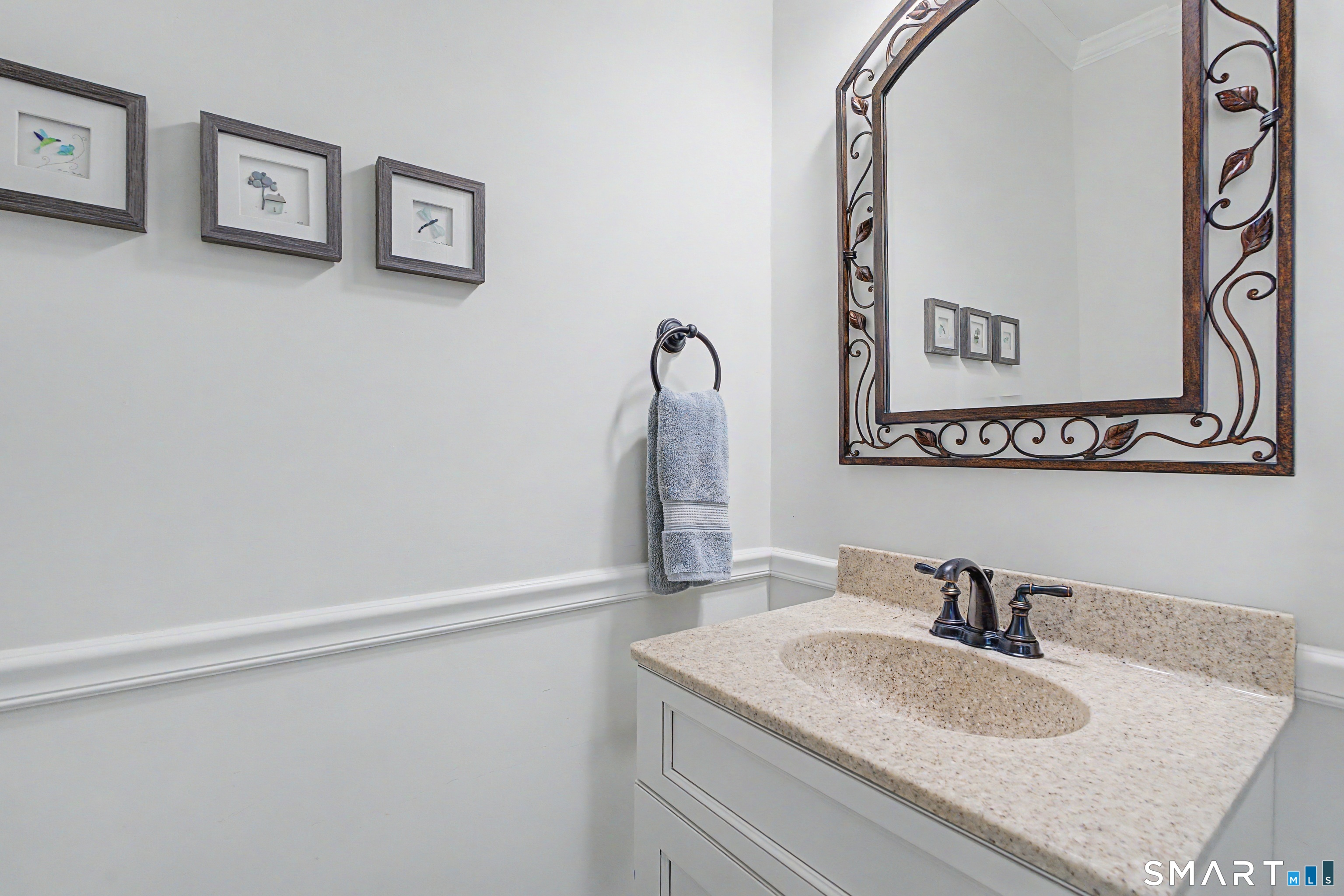 211 Meadowbrook Road, Unit 211 Oxford, CT 06478 - Photo 23 of 38 Main-level powder room with a stone-topped vanity and stylish finishes-perfectly convenient for guests.