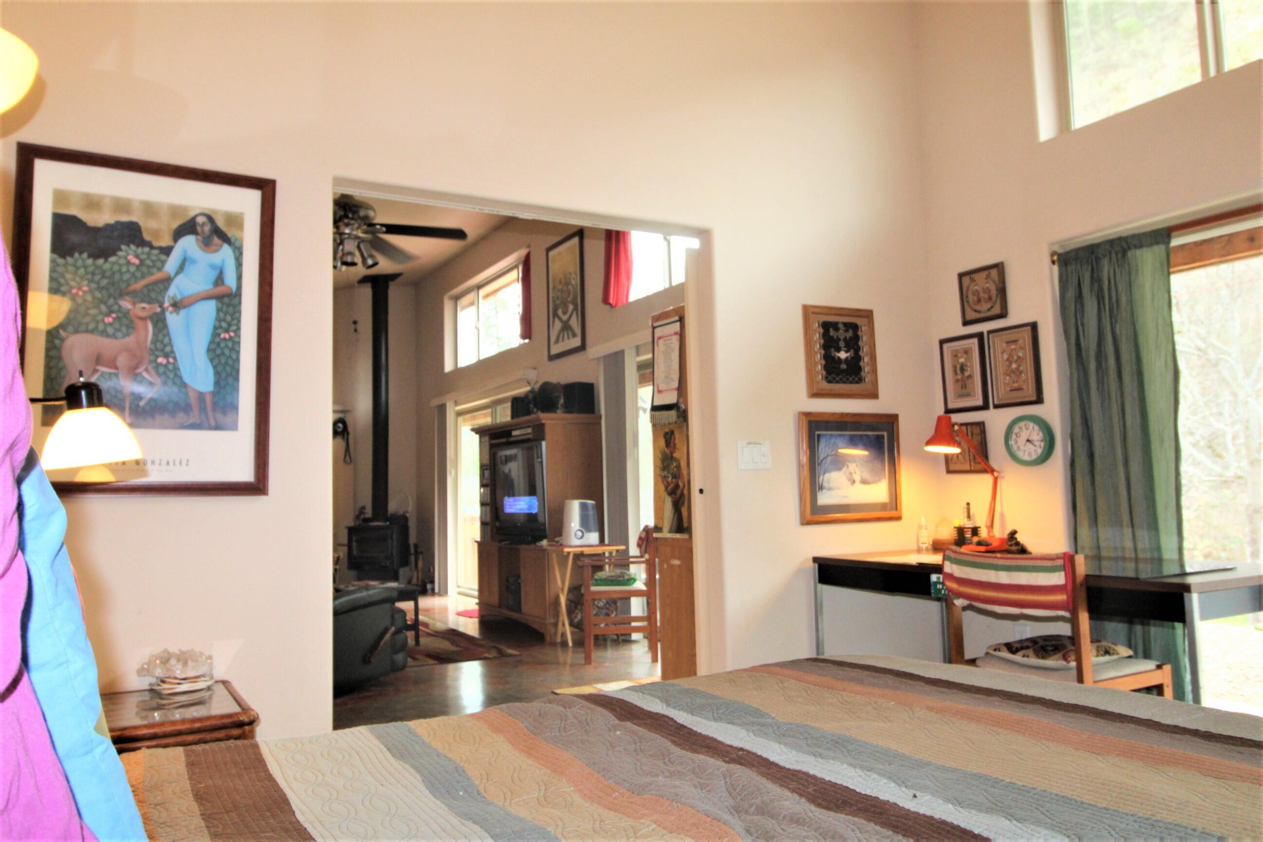 2200 Little Applegate Road Jacksonville, OR 97530 - Photo 21 of 39 a bedroom with furniture and a window