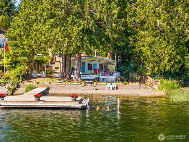 a house with swimming pool in front of it