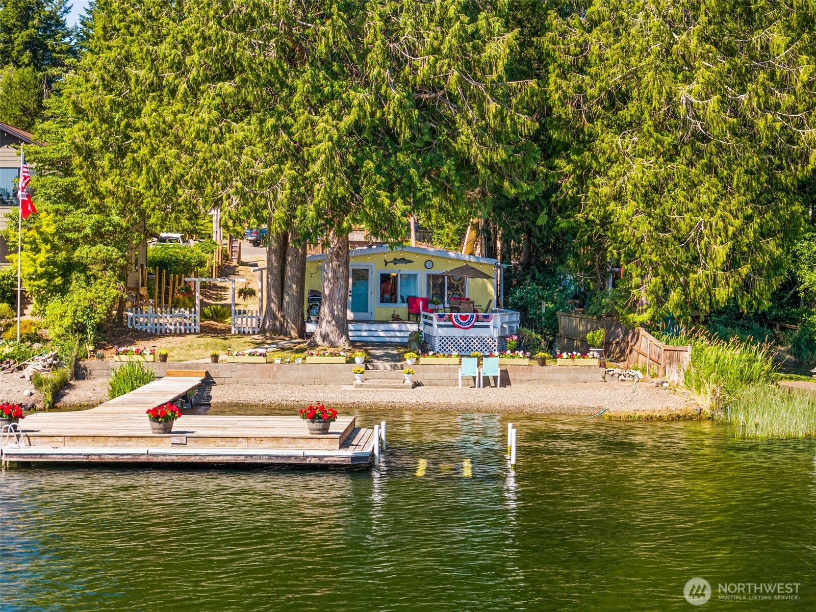 21 Shore Court Grapeview, WA 98546 - Photo 1 of 34 a house with swimming pool in front of it