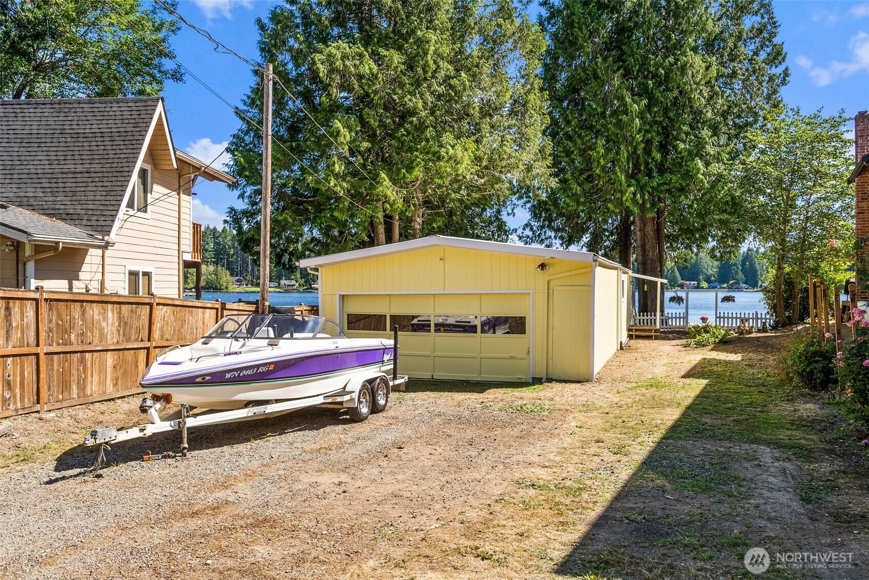 21 Shore Court Grapeview, WA 98546 - Photo 15 of 34 a view of backyard with swimming pool and outdoor seating