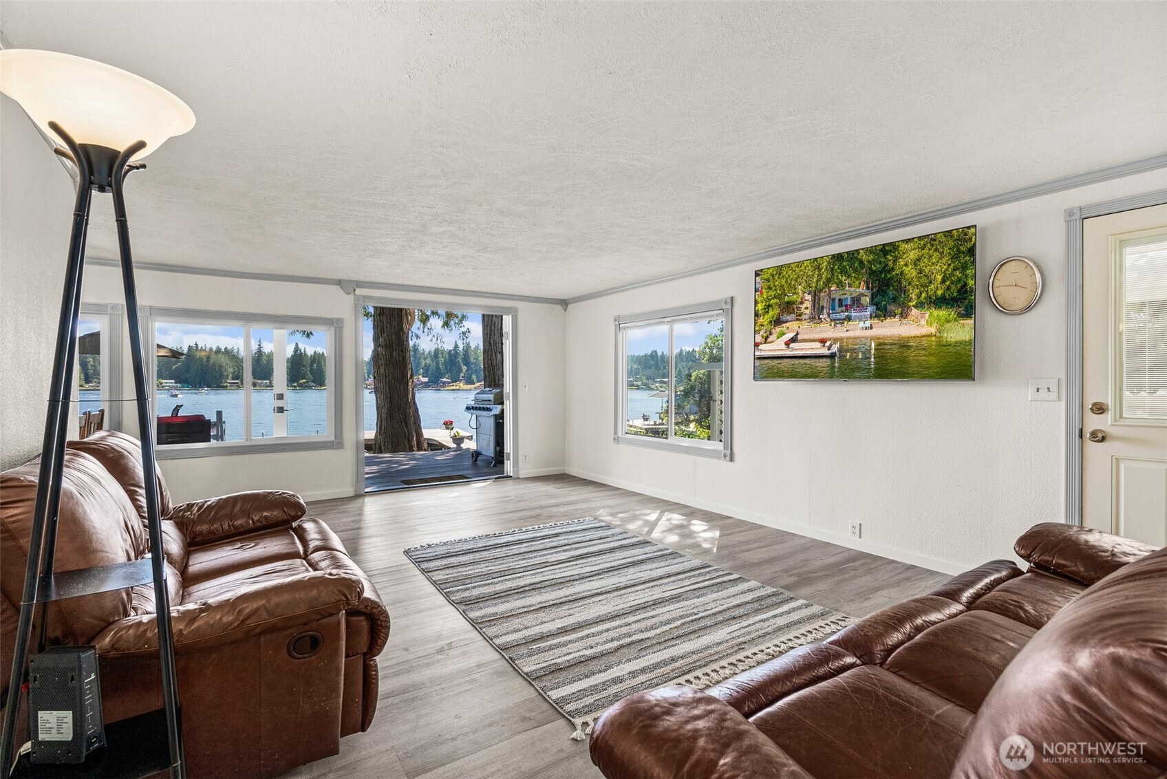 21 Shore Court Grapeview, WA 98546 - Photo 17 of 34 a bedroom with a bed and a balcony