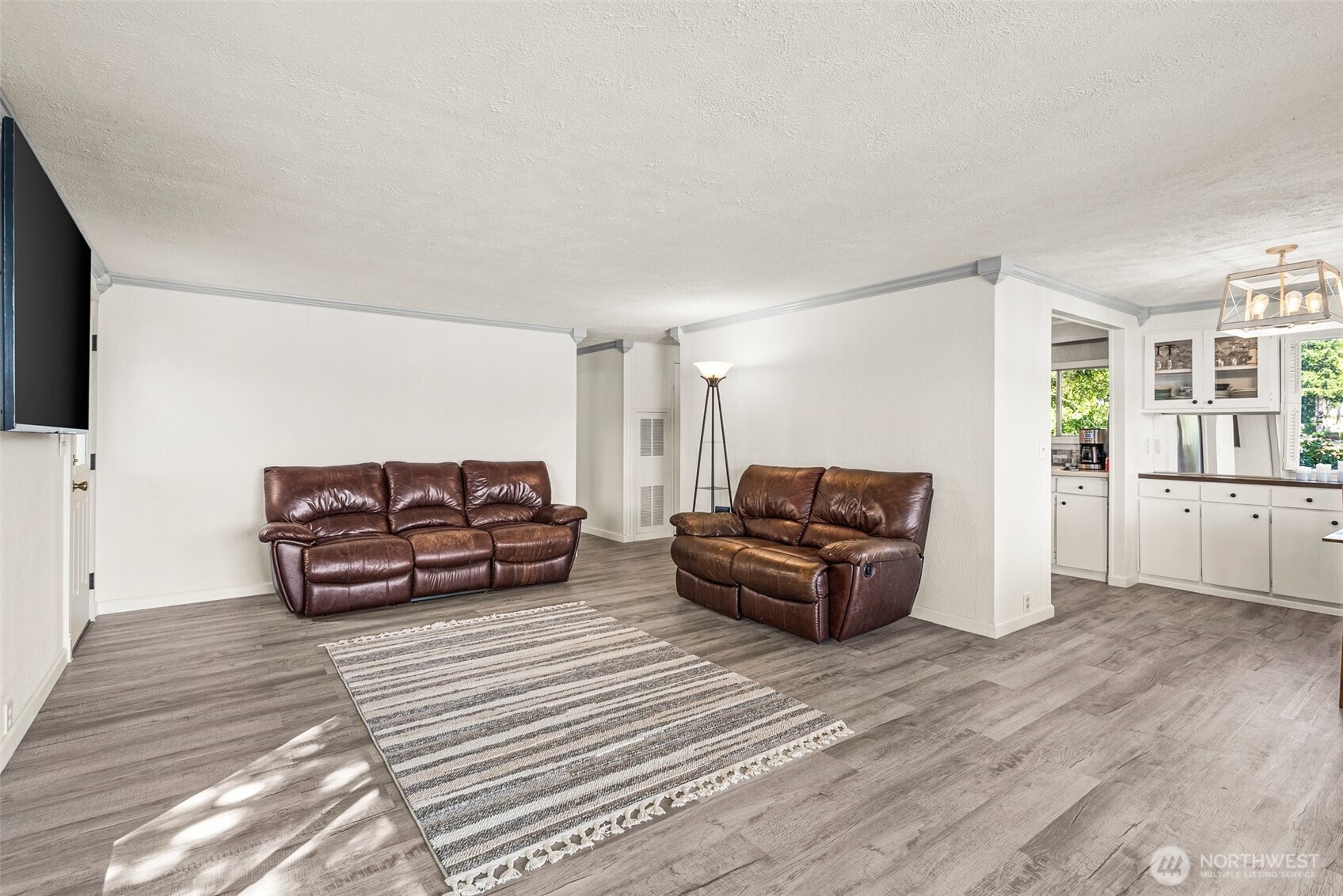21 Shore Court Grapeview, WA 98546 - Photo 18 of 34 a living room with furniture and a flat screen tv