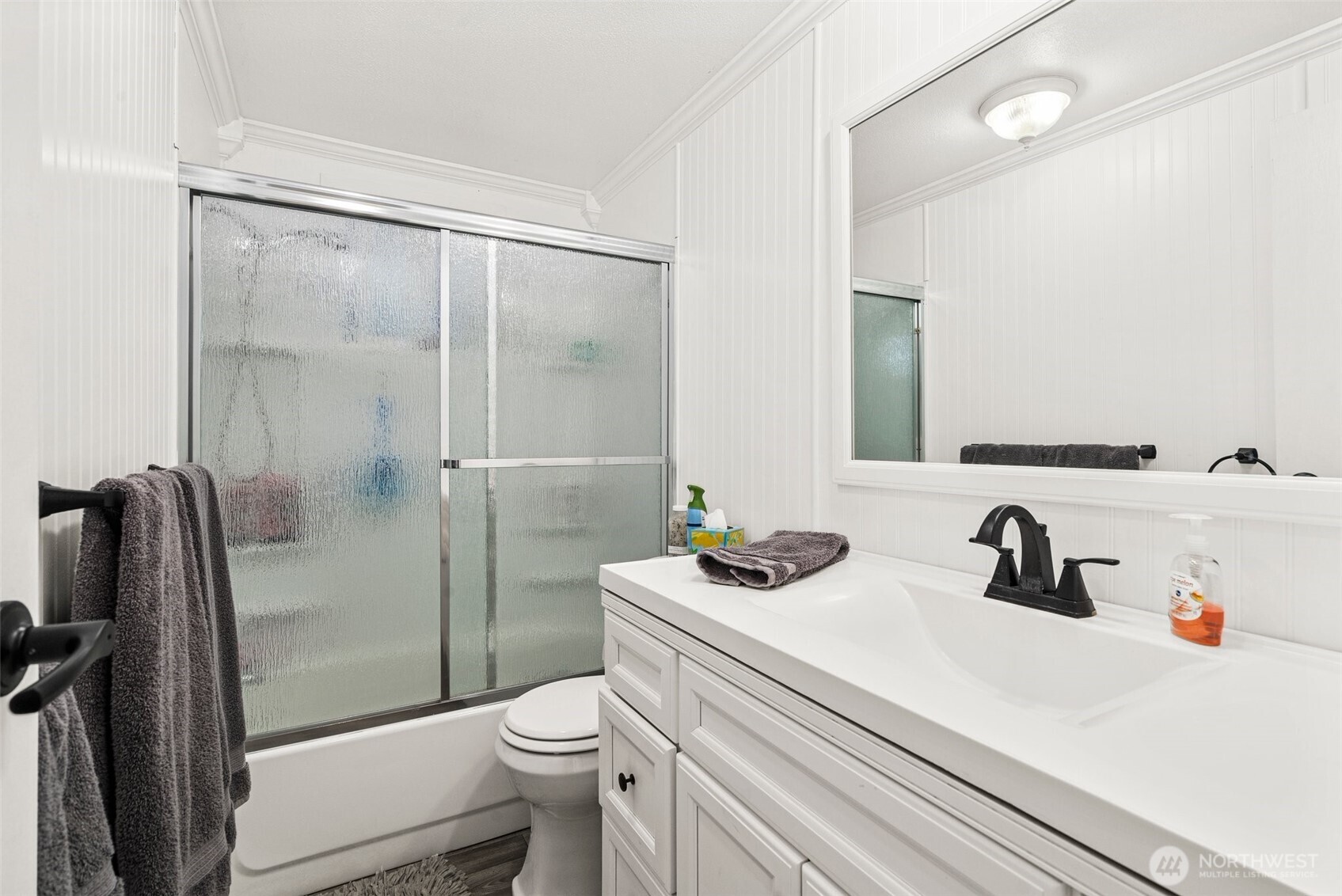 21 Shore Court Grapeview, WA 98546 - Photo 25 of 34 a bathroom with a sink a toilet and shower