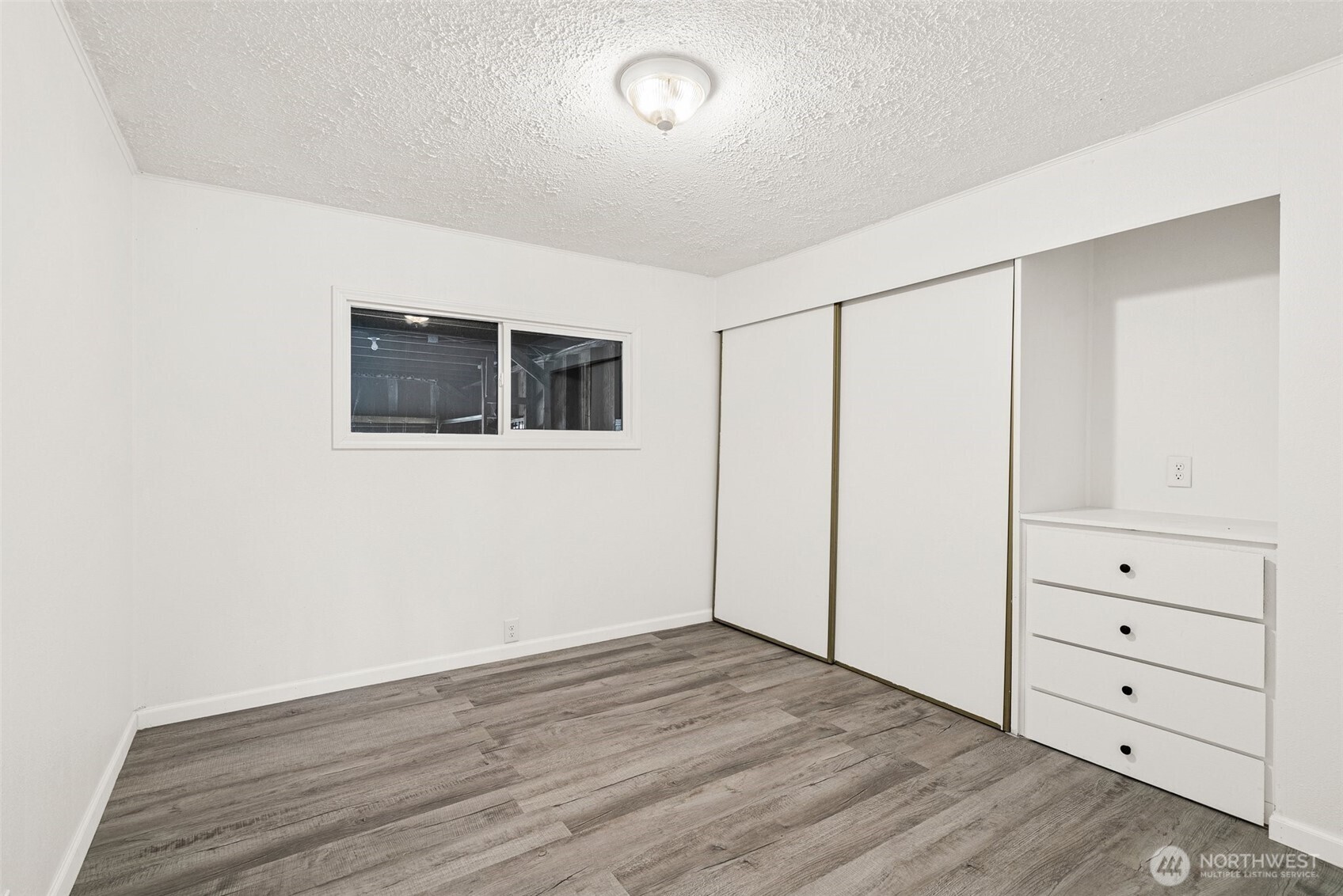 21 Shore Court Grapeview, WA 98546 - Photo 26 of 34 a view of a livingroom with wooden floor