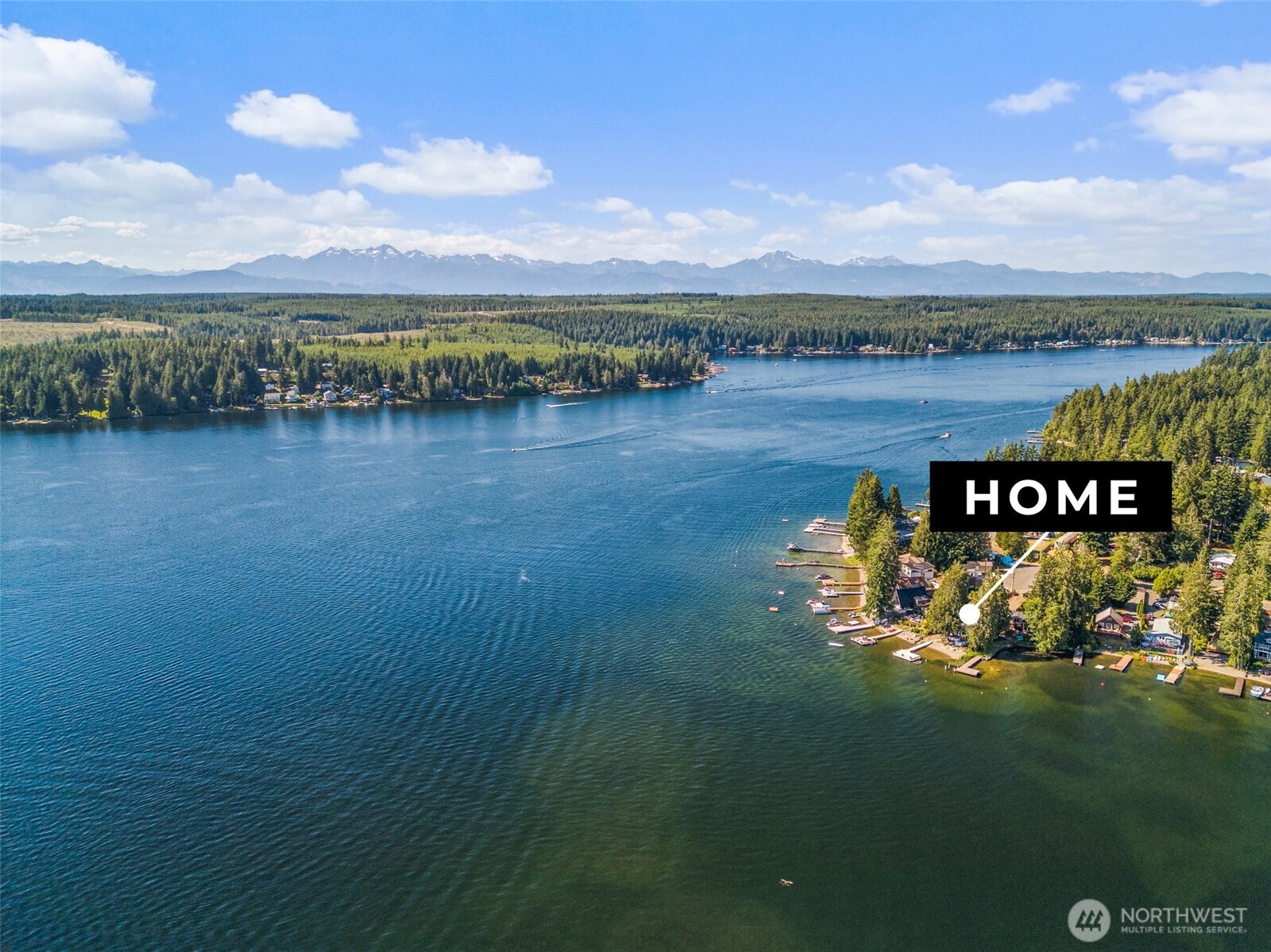 21 Shore Court Grapeview, WA 98546 - Photo 28 of 34 a view of a lake with houses in the back