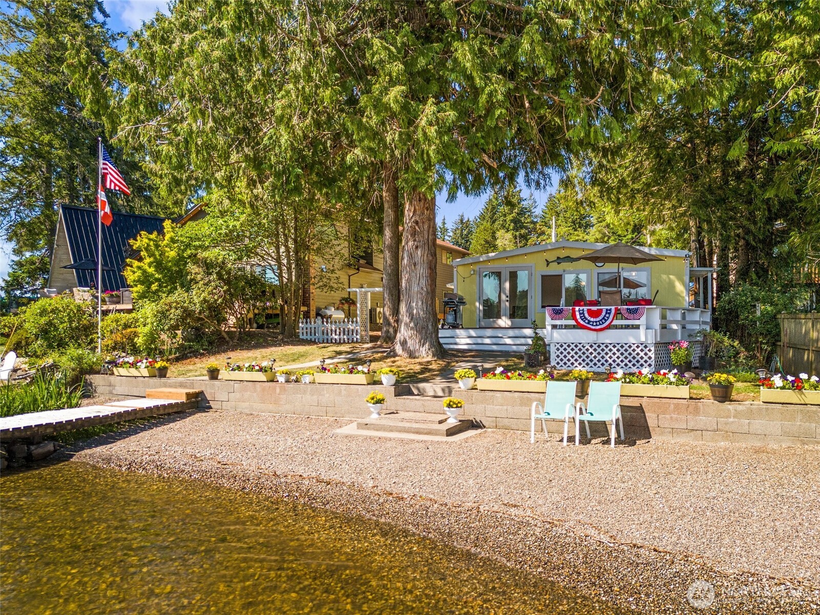 21 Shore Court Grapeview, WA 98546 - Photo 4 of 34 a view of a swimming pool with an outdoor seating