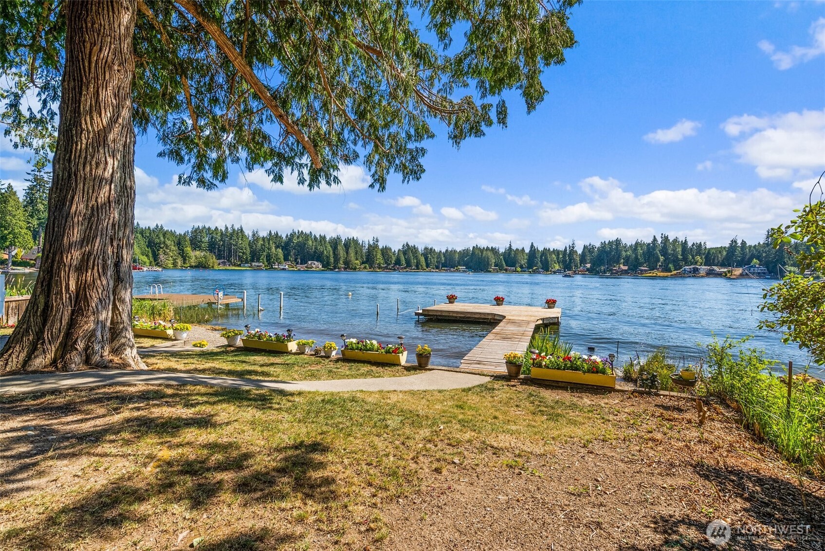21 Shore Court Grapeview, WA 98546 - Photo 7 of 34 a view of a lake with houses in the back
