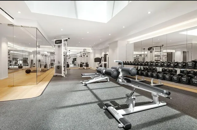a view of a backyard with furniture and wooden floor