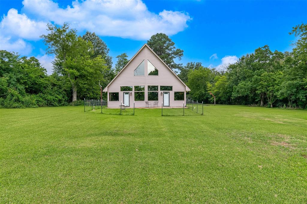 10307 Pirogue Road Oil City, LA 71061 - Photo 2 of 36 a house view with a garden space