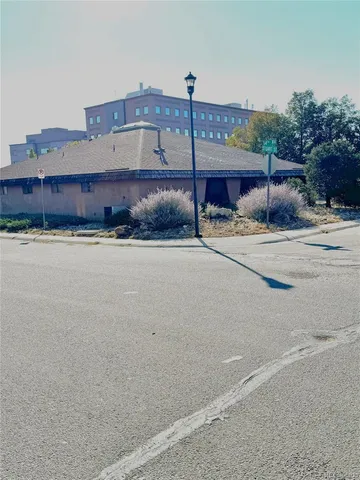 a view of a house with a street