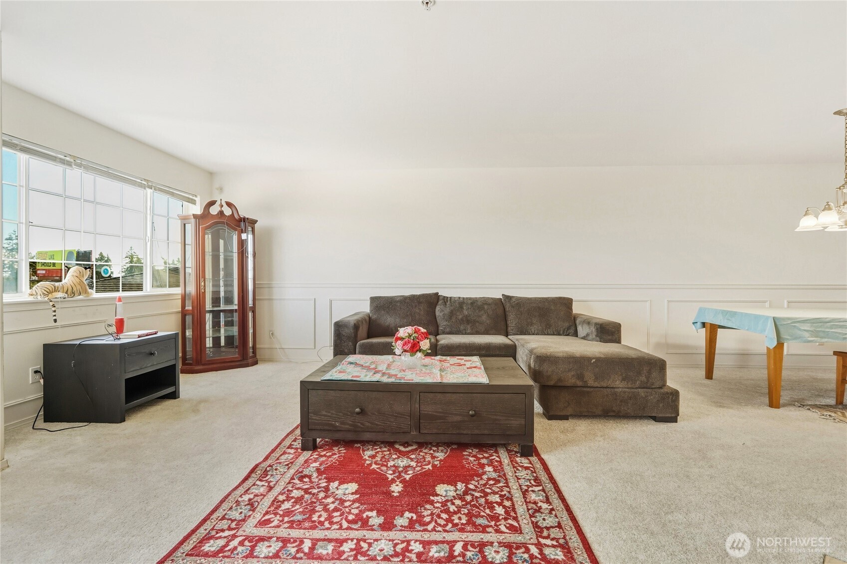 7818 228th Street Southwest, Unit 106 Edmonds, WA 98026 - Photo 2 of 19 a living room with furniture and a rug