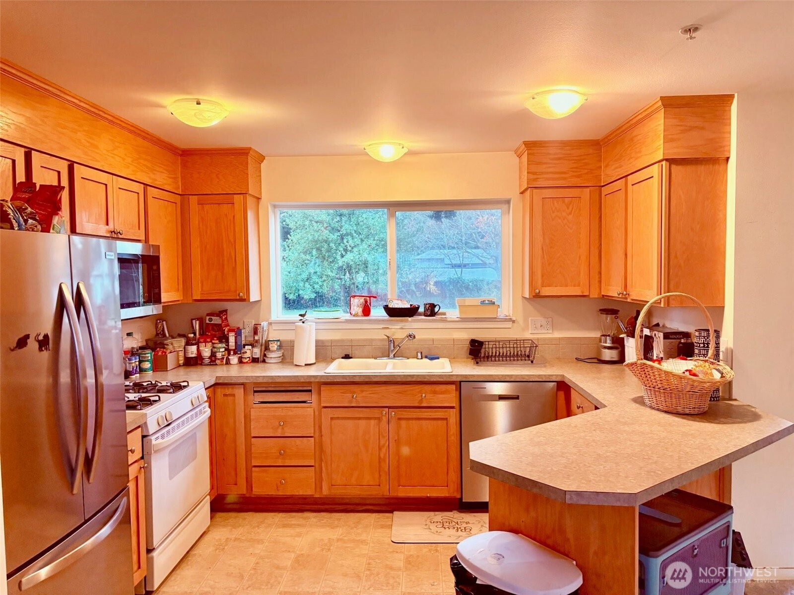 7818 228th Street Southwest, Unit 106 Edmonds, WA 98026 - Photo 4 of 19 a kitchen with lots of counter top space and windows