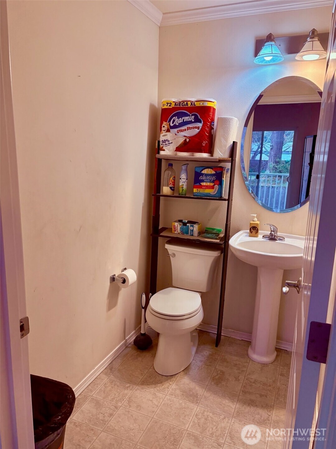 7818 228th Street Southwest, Unit 106 Edmonds, WA 98026 - Photo 6 of 19 a bathroom with a toilet sink vanity and mirror