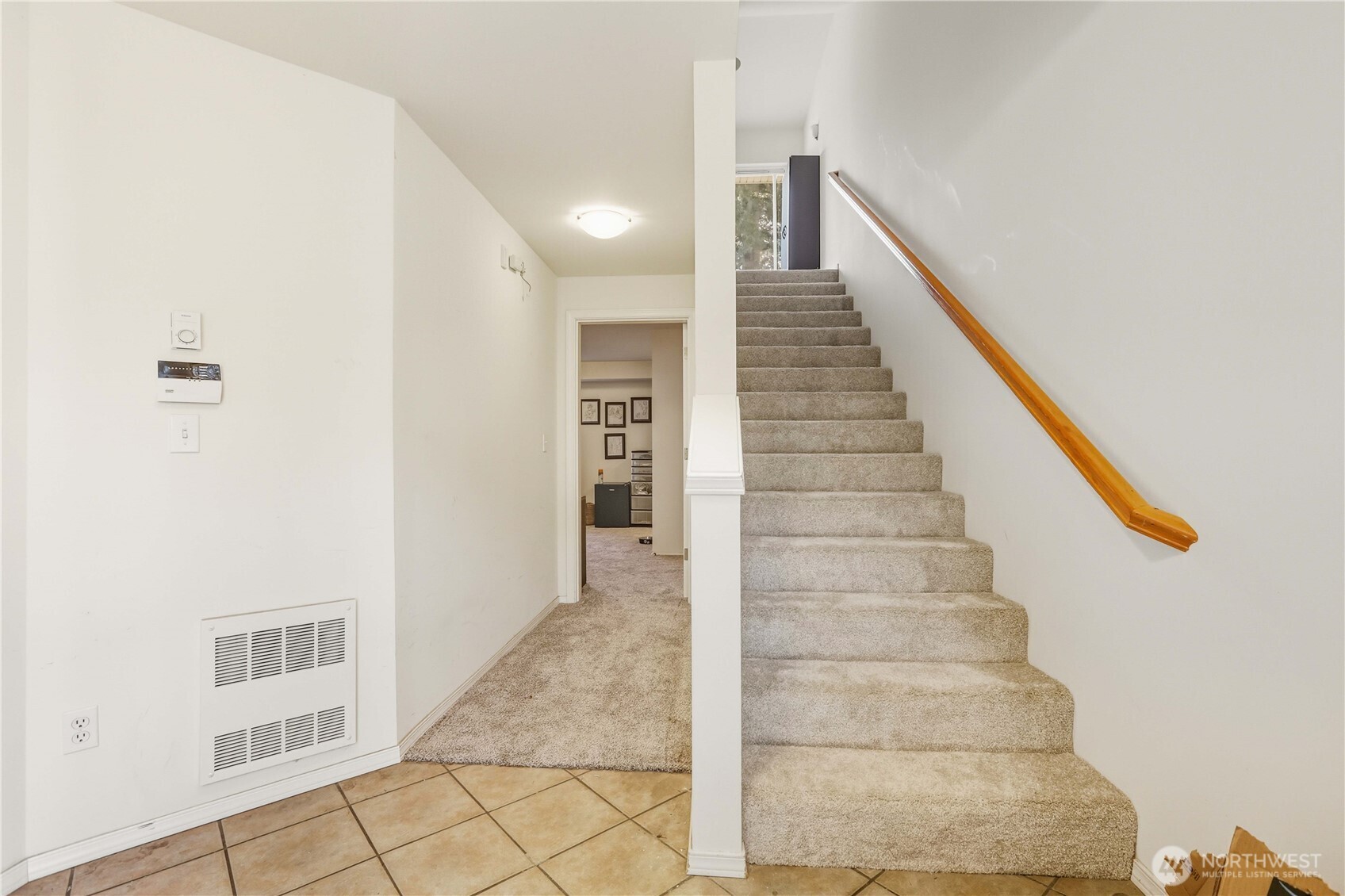 7818 228th Street Southwest, Unit 106 Edmonds, WA 98026 - Photo 7 of 19 a view of staircase with white walls and a window