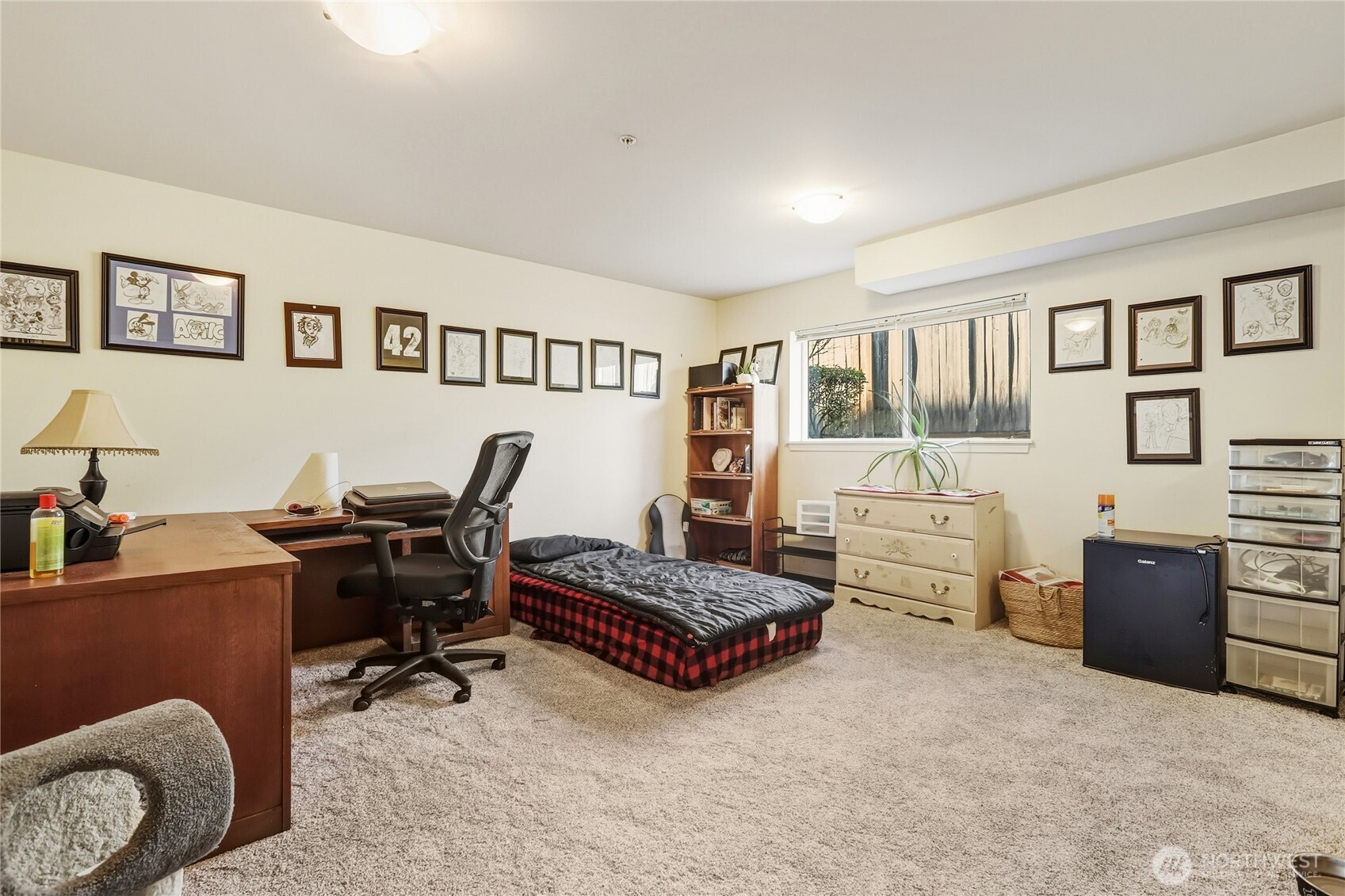 7818 228th Street Southwest, Unit 106 Edmonds, WA 98026 - Photo 9 of 19 a bedroom with furniture and a window