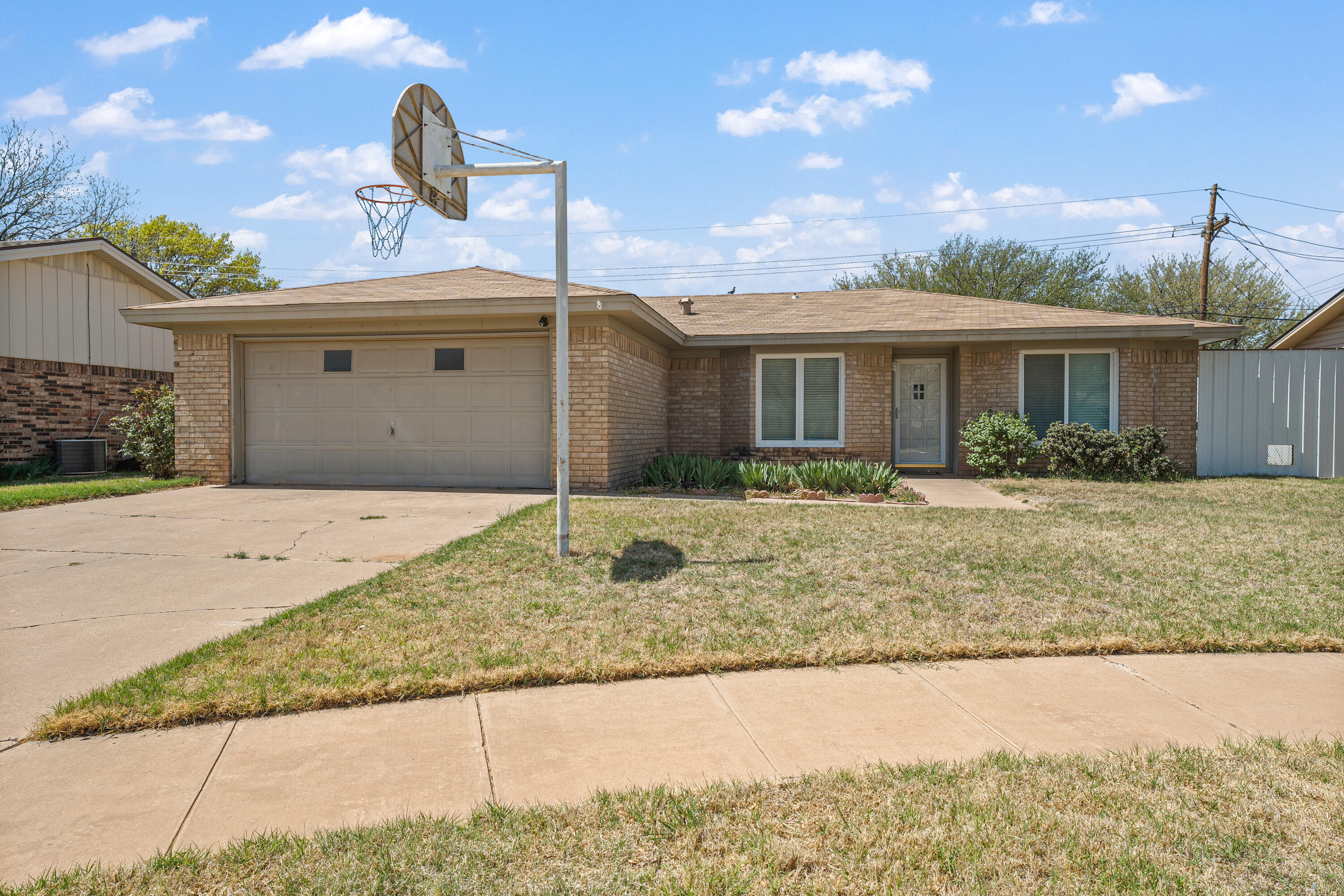 7004 Wayne Avenue Lubbock, TX 79424 - Photo 2 of 29 a front view of a house with garden