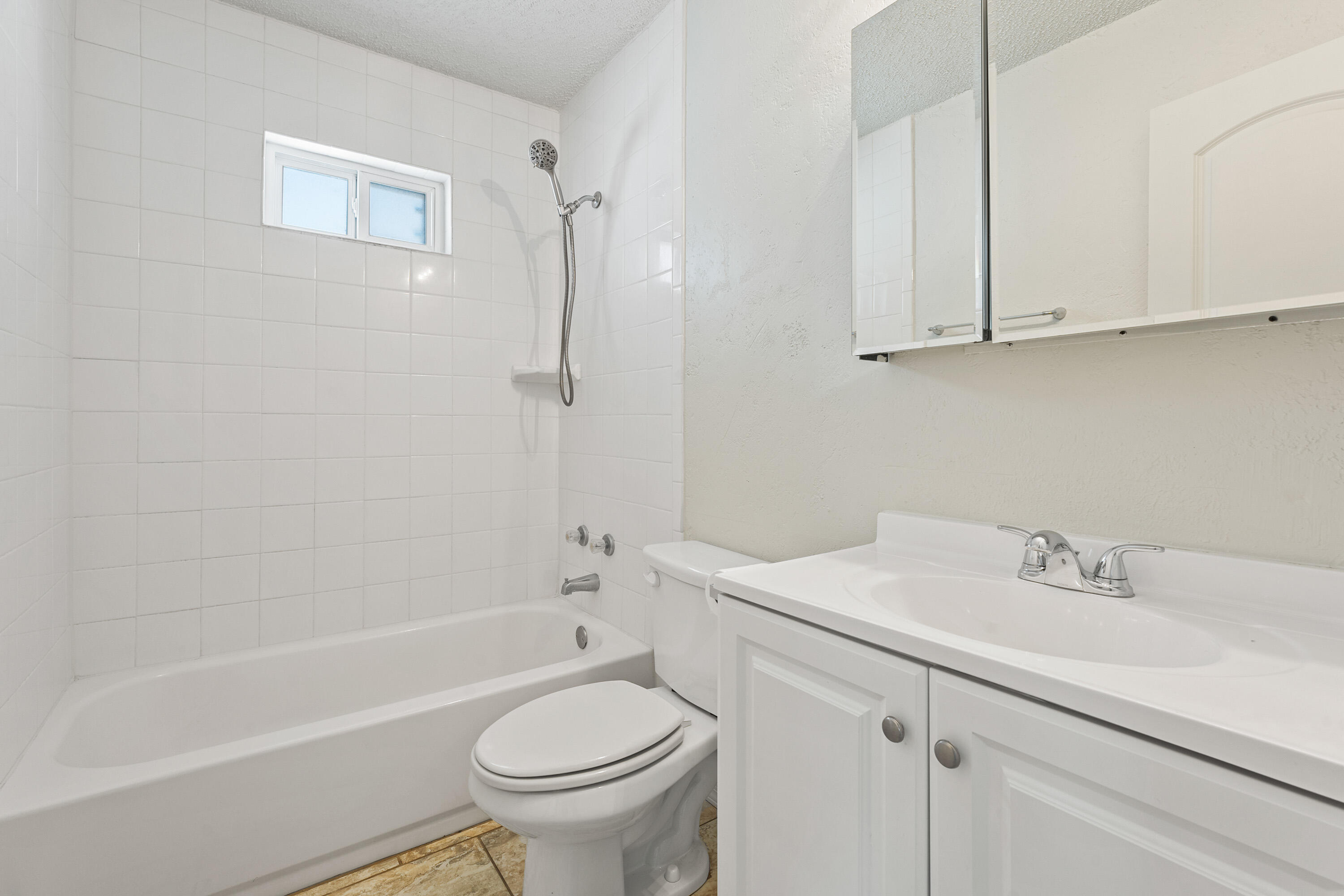 7004 Wayne Avenue Lubbock, TX 79424 - Photo 23 of 29 a bathroom with a sink a toilet and a bathtub