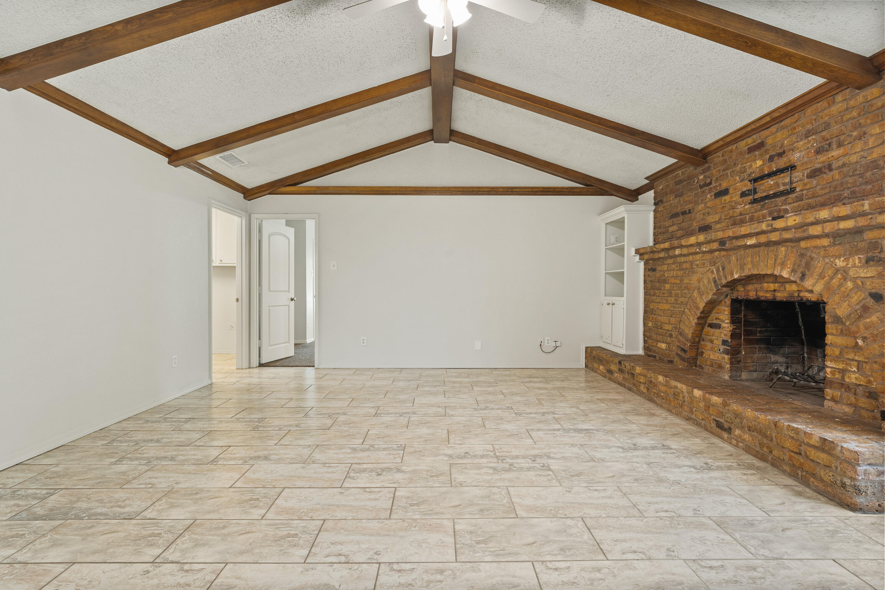 7004 Wayne Avenue Lubbock, TX 79424 - Photo 7 of 29 a view of empty room with fireplace