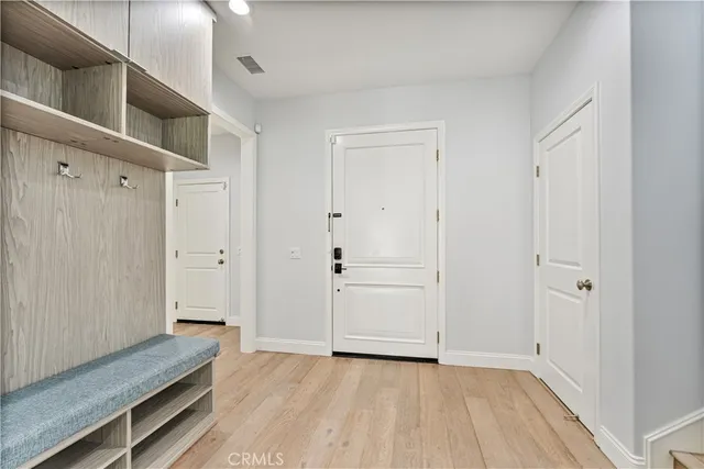 a aerial view of a house with a yard and potted plants
