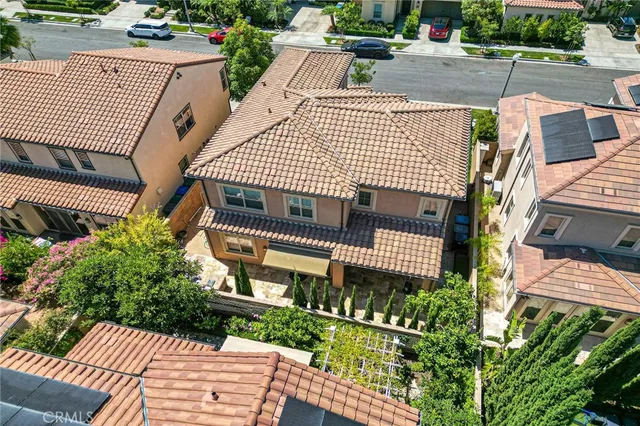 an aerial view of residential houses with city view