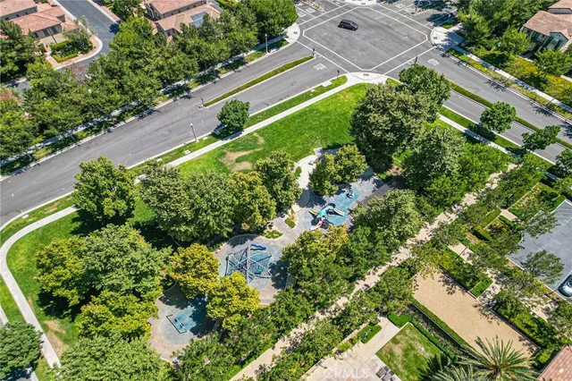 a front view of a house with yard and trees