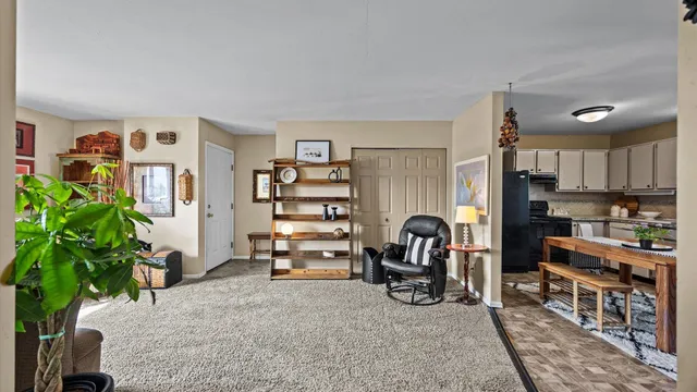 a view of a workspace with furniture and a potted plant